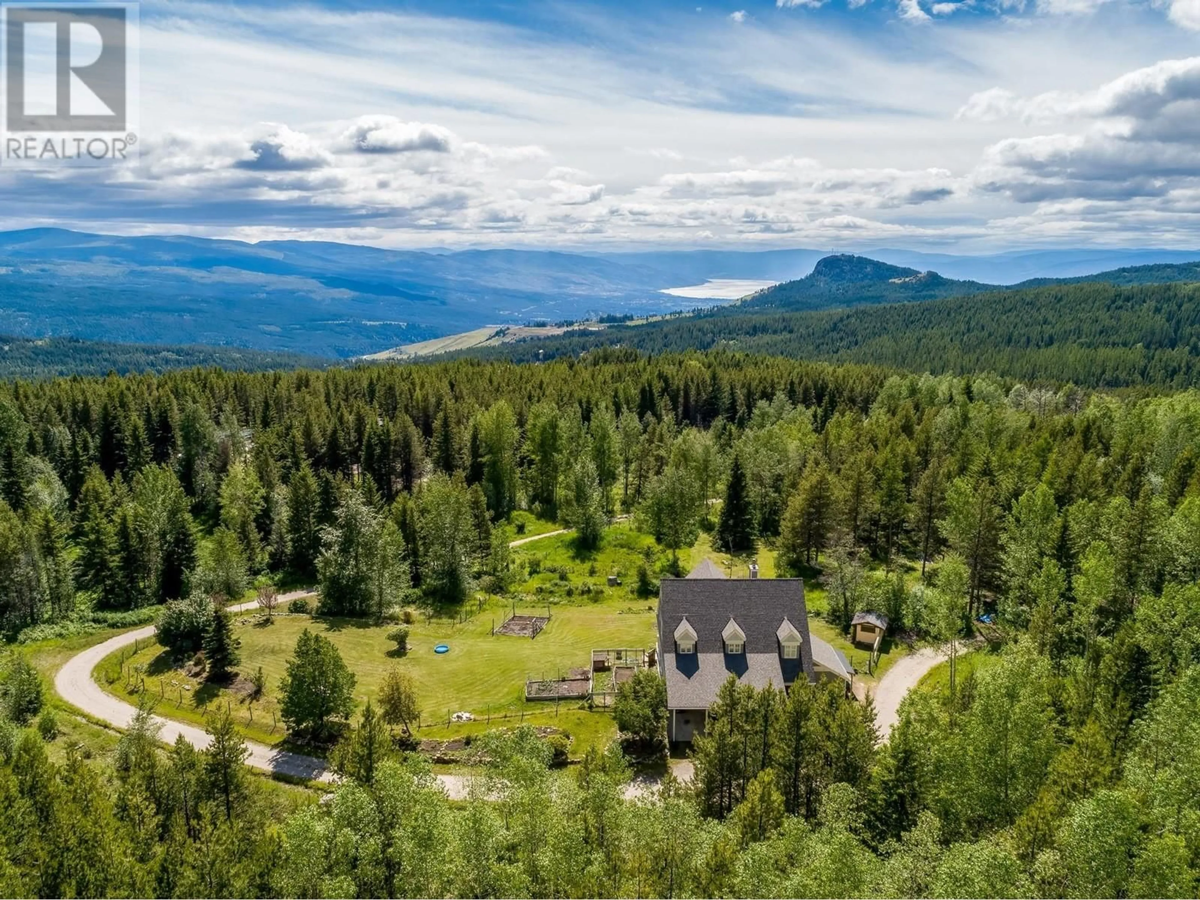 A pic from outside/outdoor area/front of a property/back of a property/a pic from drone, mountain view for 1577 BOONE COURT, Kelowna British Columbia V1P1H7