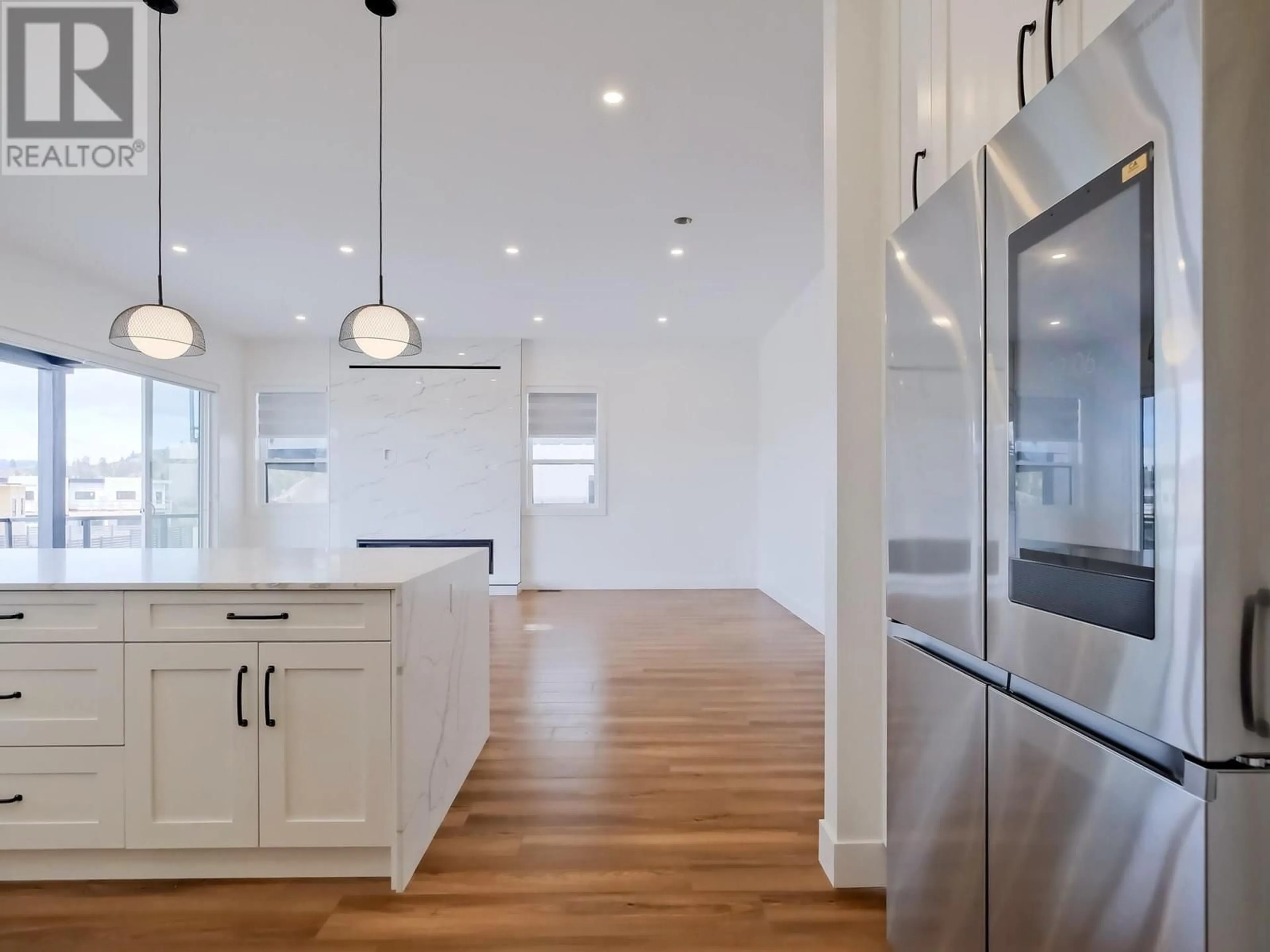 Open concept kitchen, wood/laminate floor for 1097 ANTLER DRIVE, Penticton British Columbia V2A0C8
