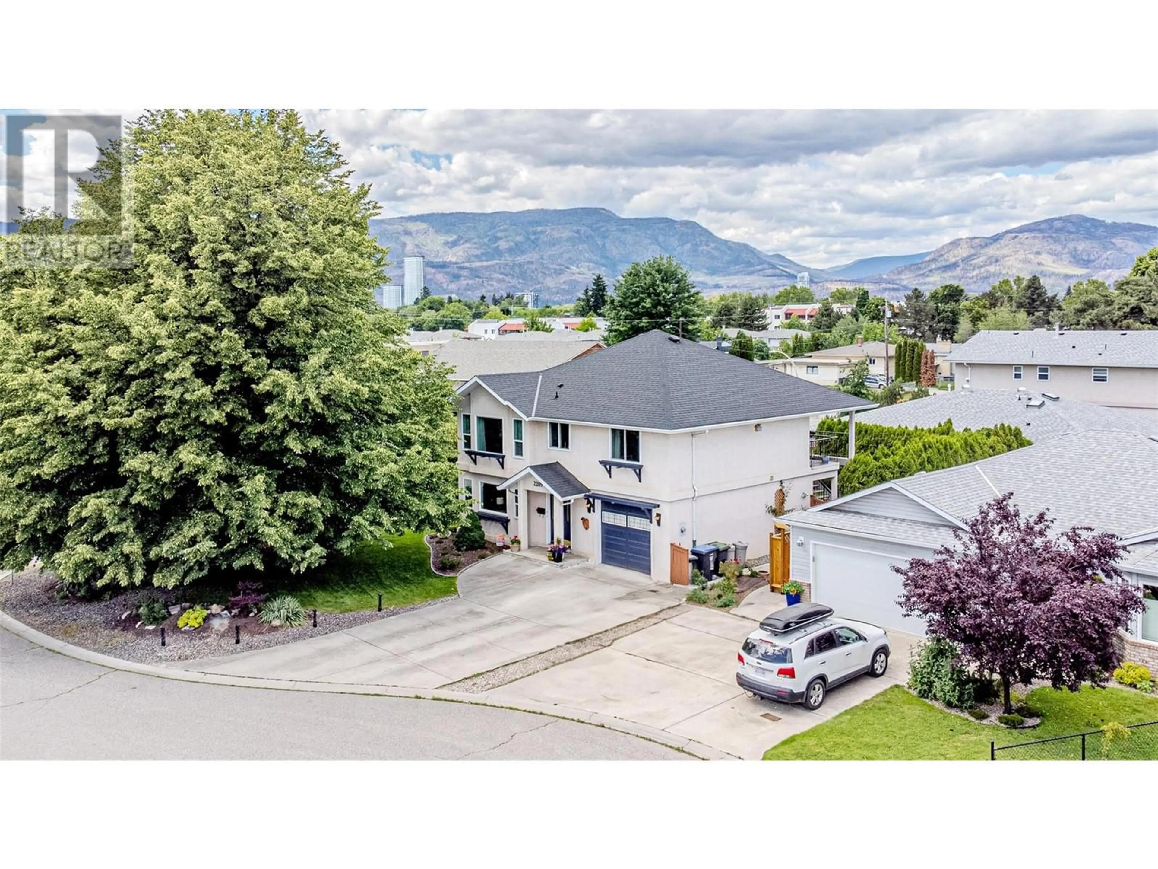 A pic from outside/outdoor area/front of a property/back of a property/a pic from drone, mountain view for 2209 STILLINGFLEET COURT, Kelowna British Columbia V1Y9N3