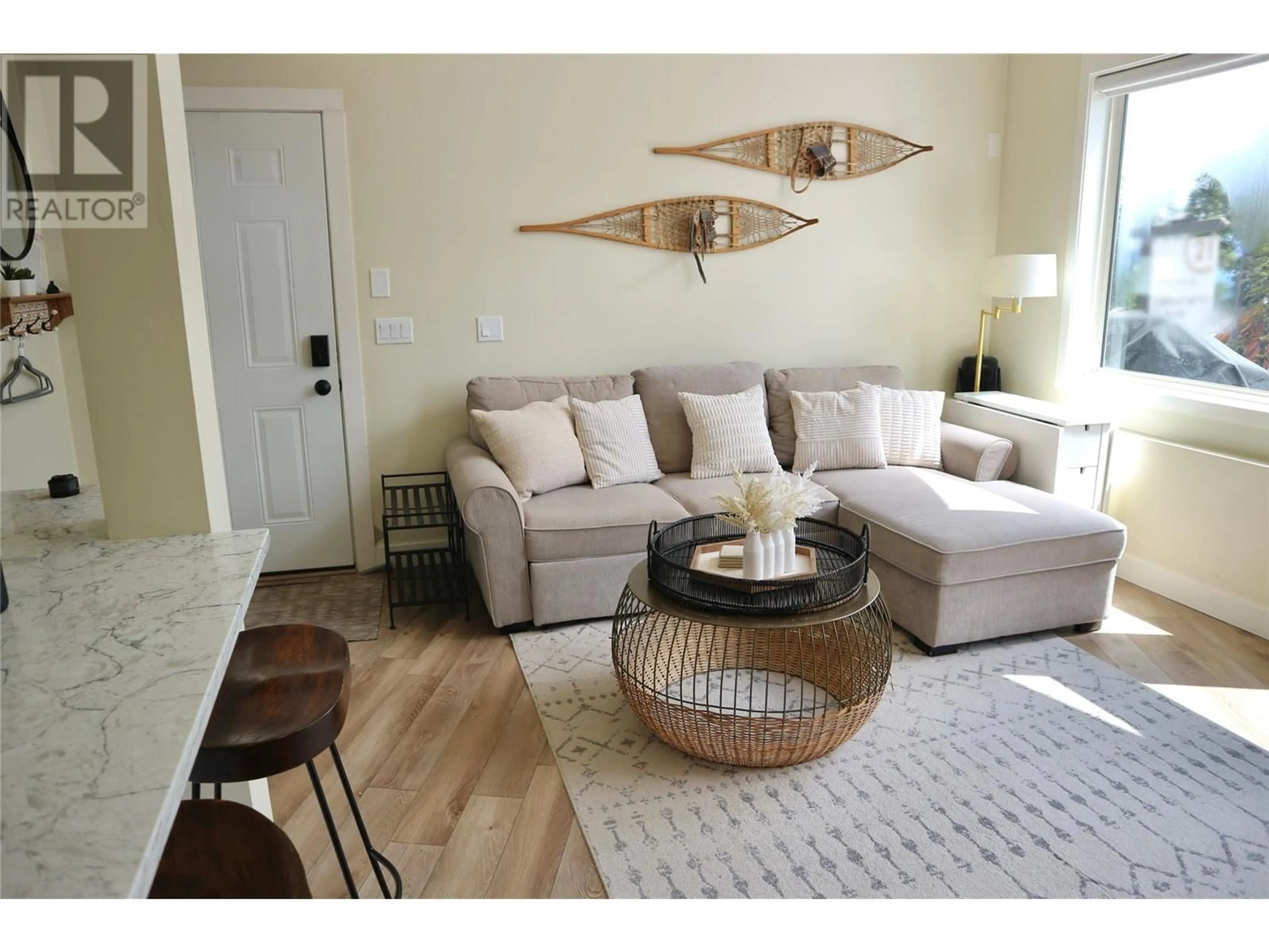 Living room with furniture, wood/laminate floor for 117C - 5981 SNOW PINES CRESCENT, Big White British Columbia V1P1P3