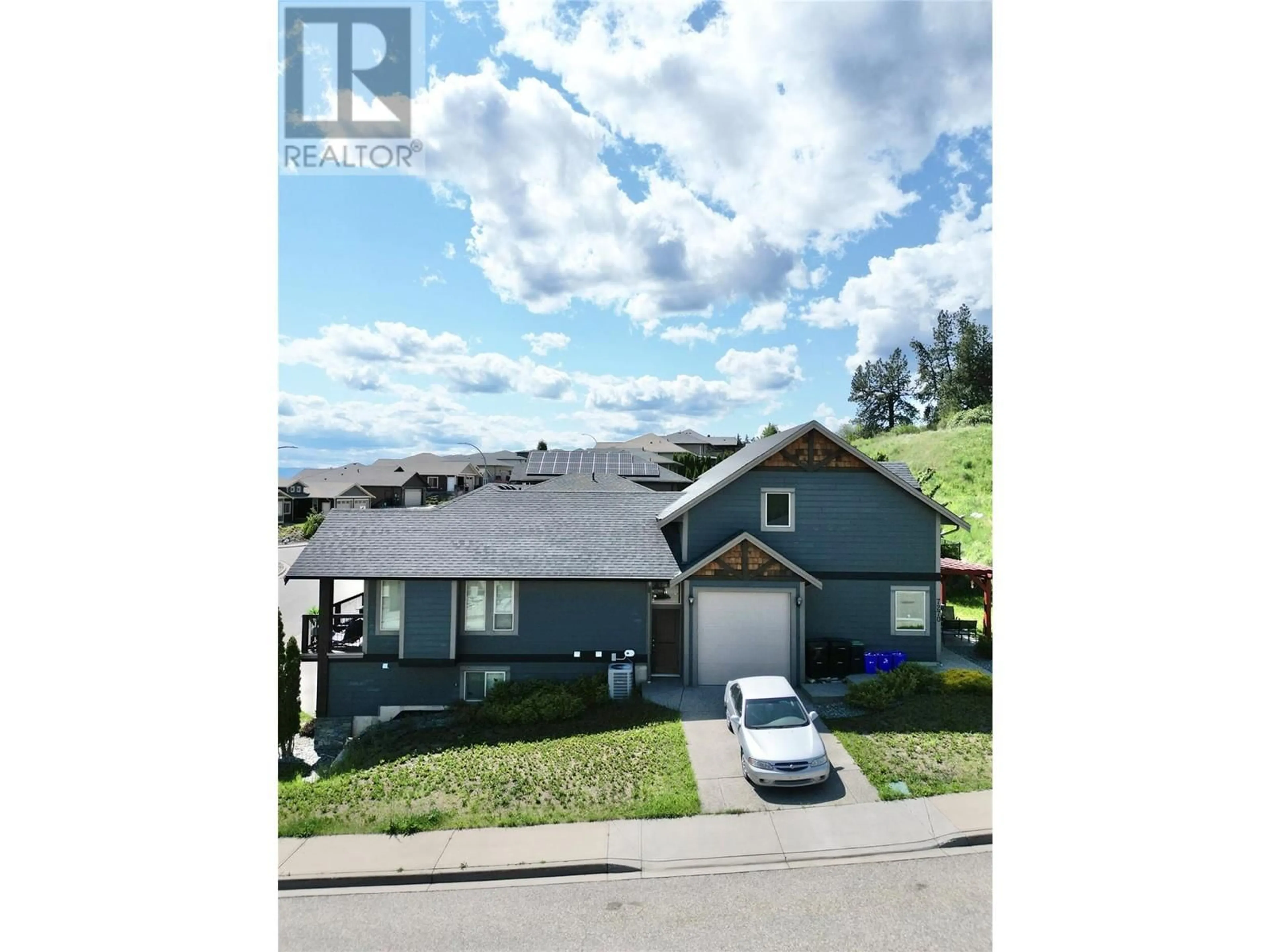 A pic from outside/outdoor area/front of a property/back of a property/a pic from drone, street for 7400 SUN PEAKS DRIVE, Vernon British Columbia V1B4C7