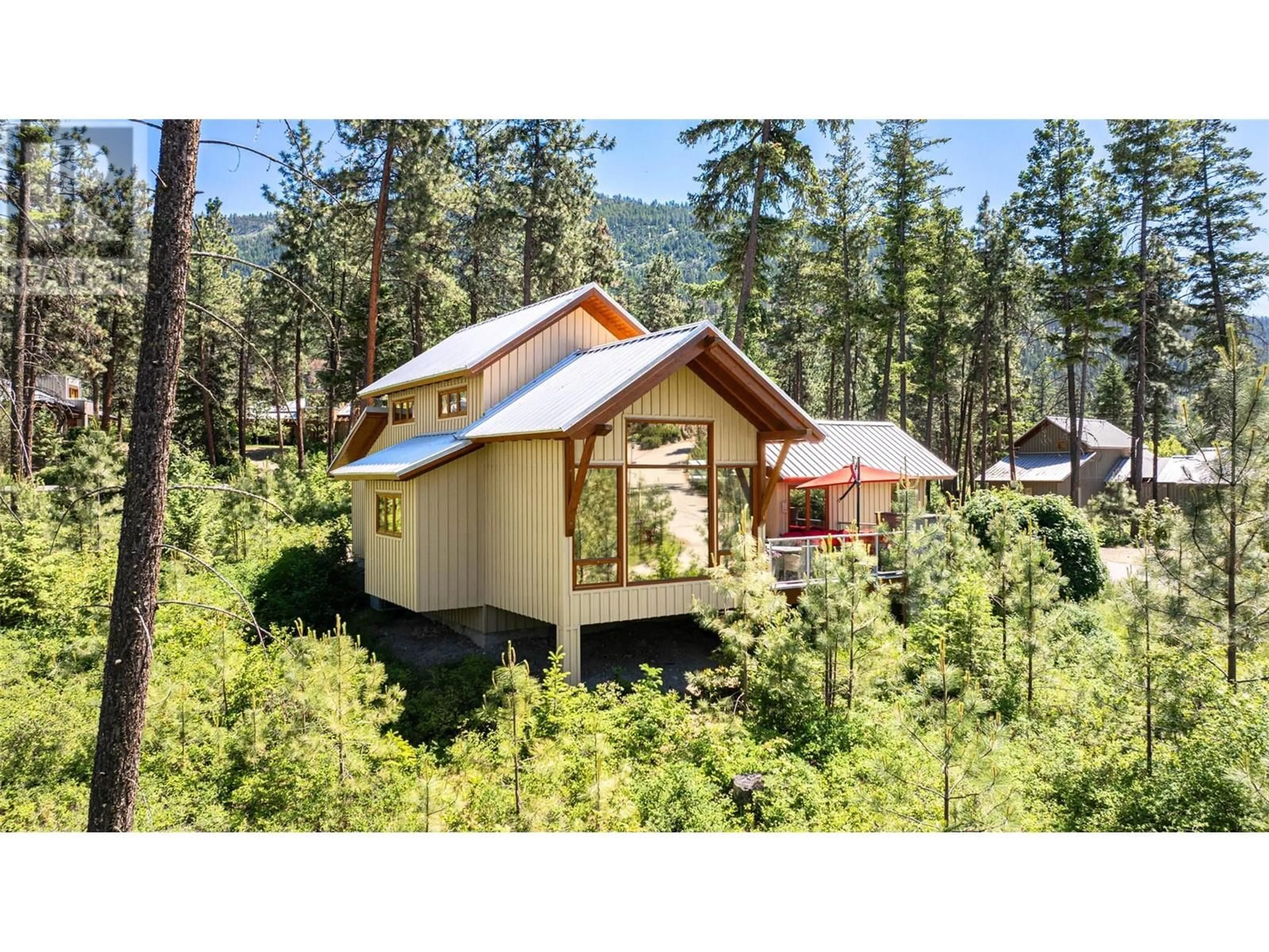 Home with vinyl exterior material, forest/trees view for 69 - 9845 EASTSIDE ROAD, Vernon British Columbia V1H1Z2