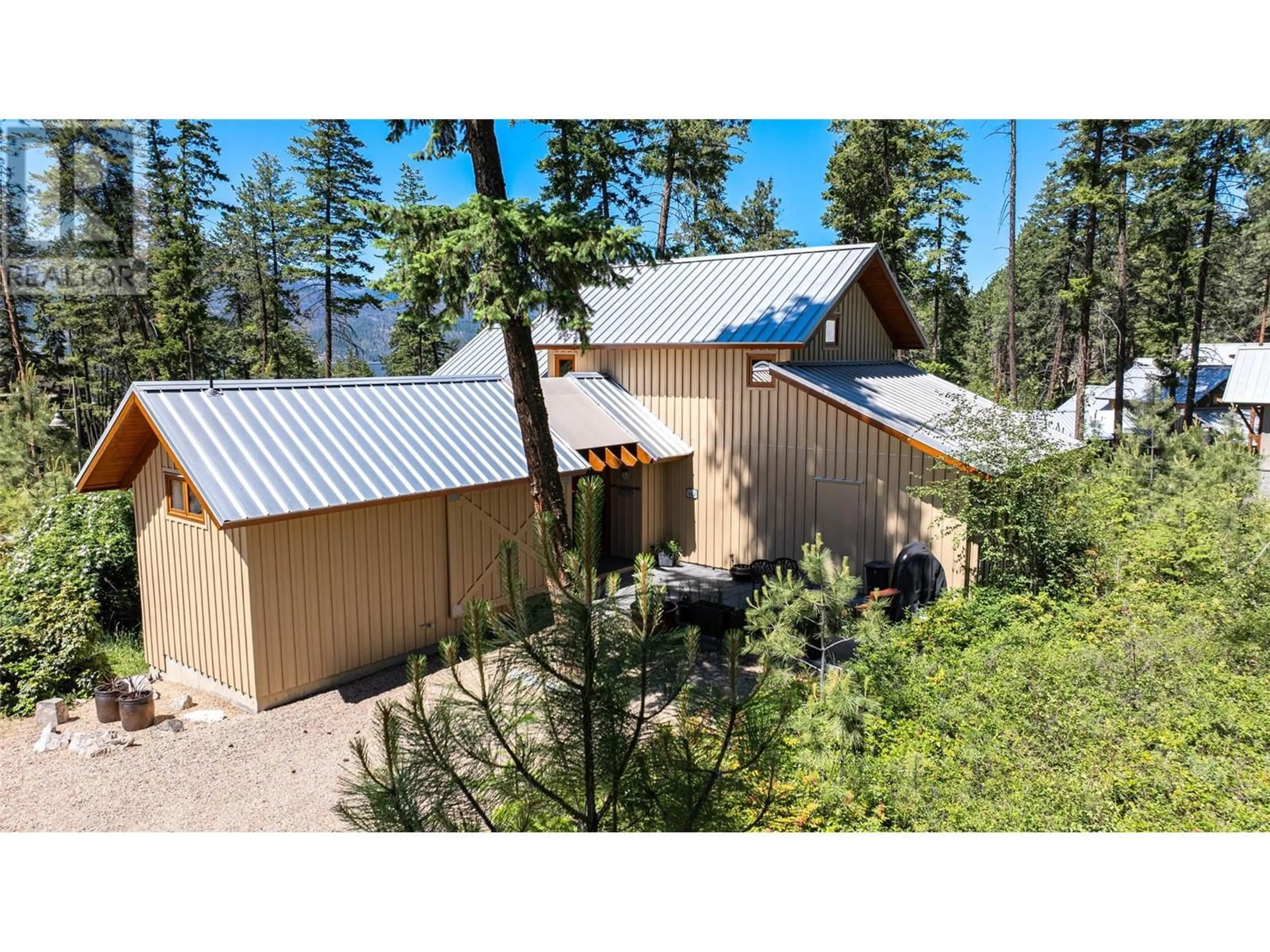 A pic from outside/outdoor area/front of a property/back of a property/a pic from drone, mountain view for 69 - 9845 EASTSIDE ROAD, Vernon British Columbia V1H1Z2