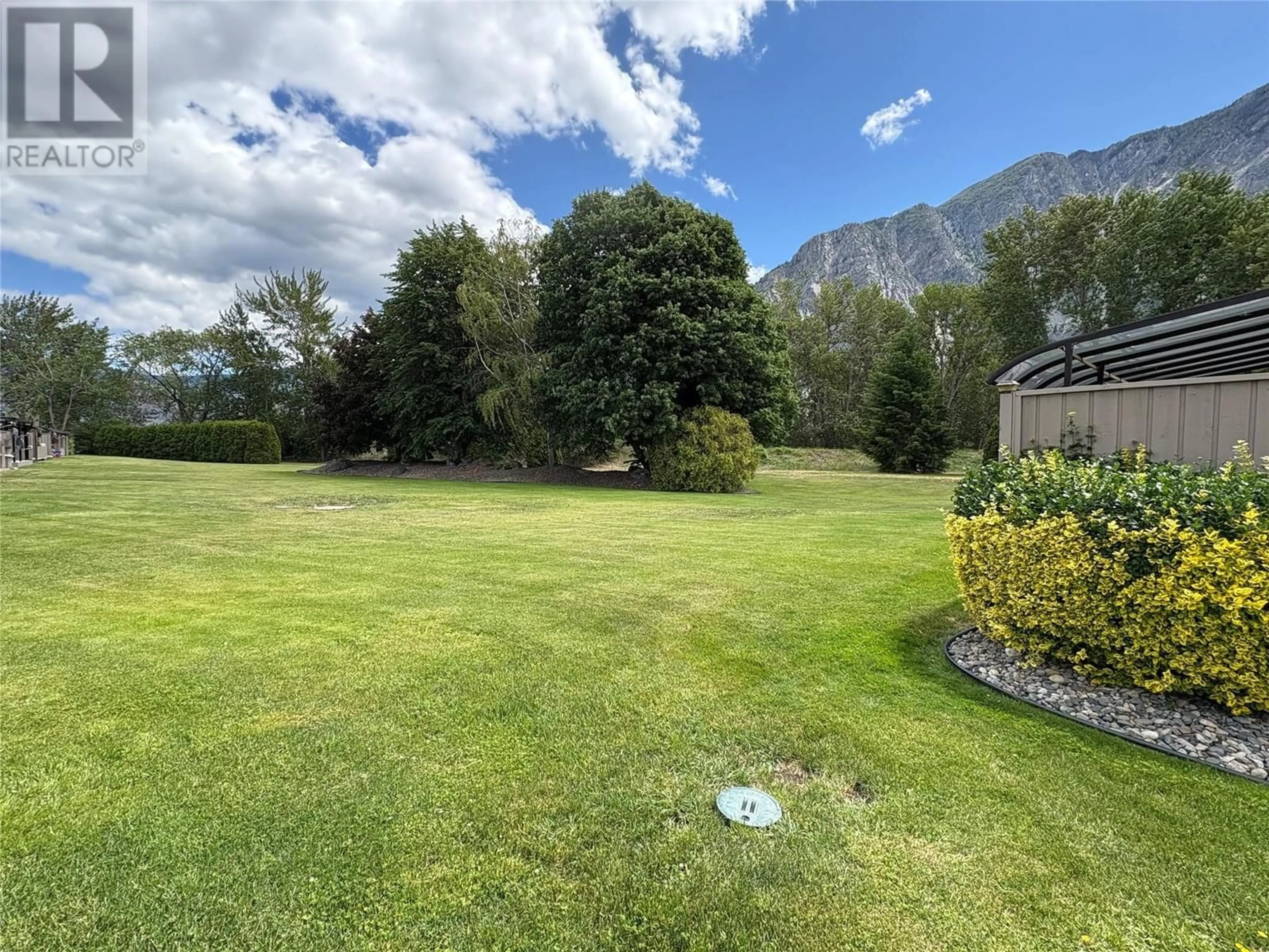 A pic from outside/outdoor area/front of a property/back of a property/a pic from drone, mountain view for 2 - 815 11TH AVENUE, Keremeos British Columbia V0X1N3
