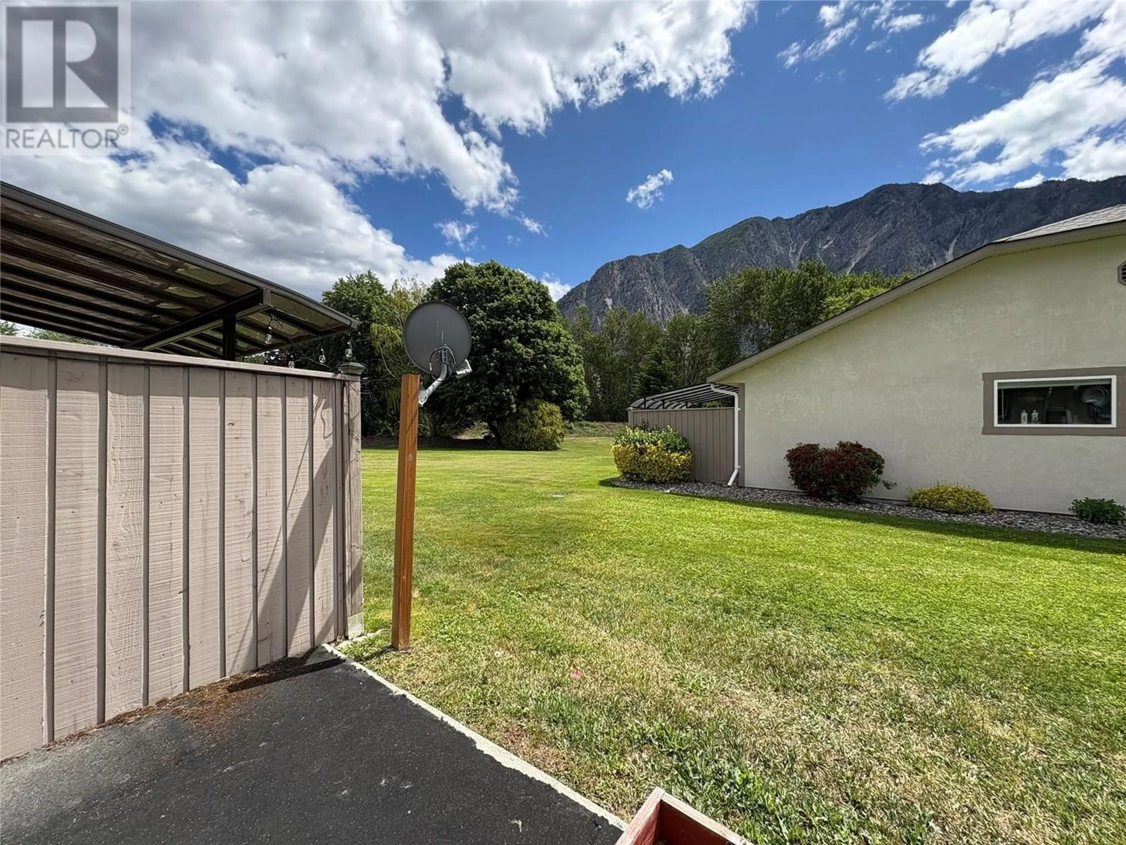A pic from outside/outdoor area/front of a property/back of a property/a pic from drone, mountain view for 2 - 815 11TH AVENUE, Keremeos British Columbia V0X1N3