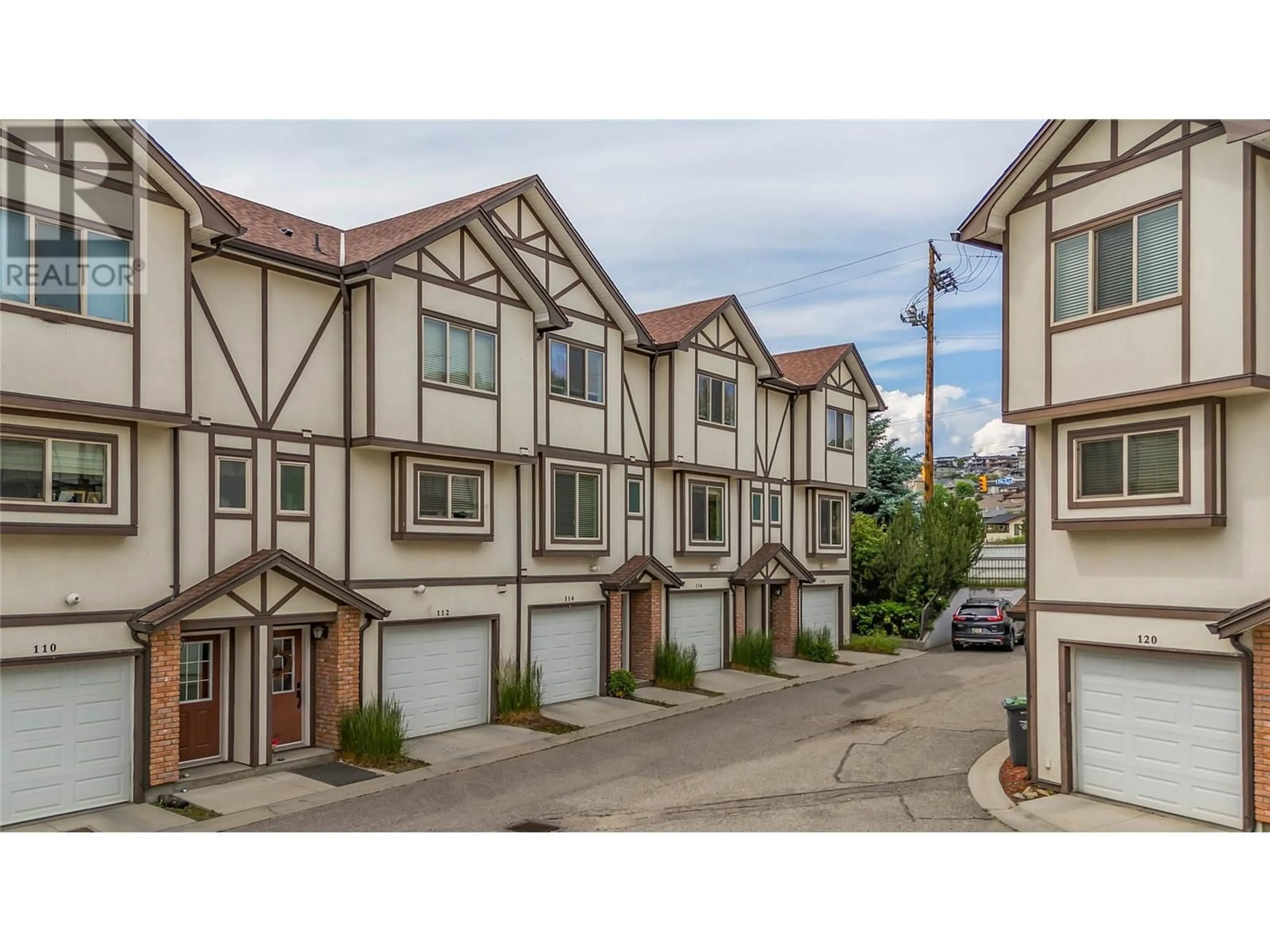 A pic from outside/outdoor area/front of a property/back of a property/a pic from drone, street for 114 - 1651 LYNRICK ROAD, Kelowna British Columbia V1P1R4
