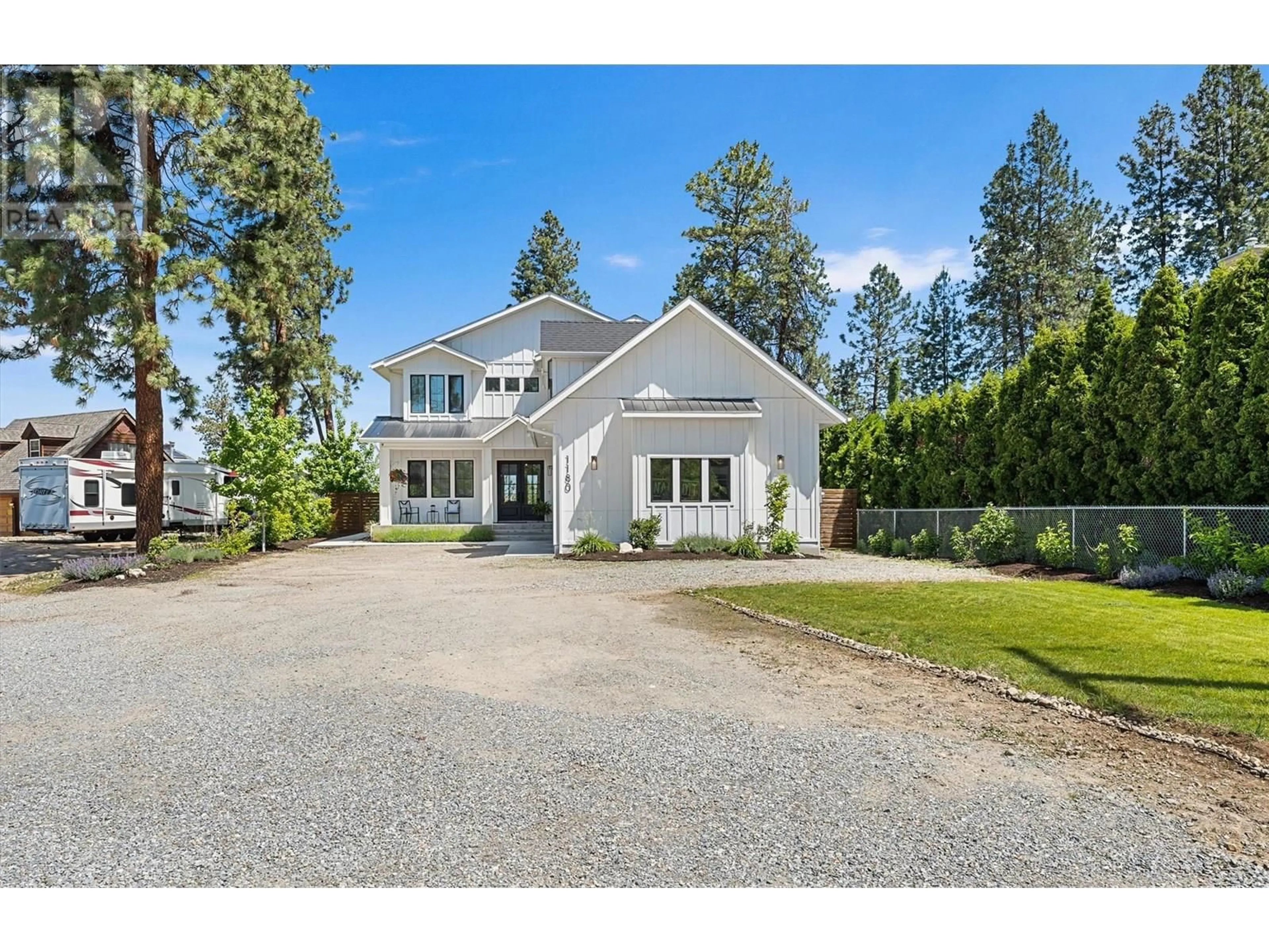 Home with vinyl exterior material, street for 1180 MISSION RIDGE ROAD, Kelowna British Columbia V1W3B2