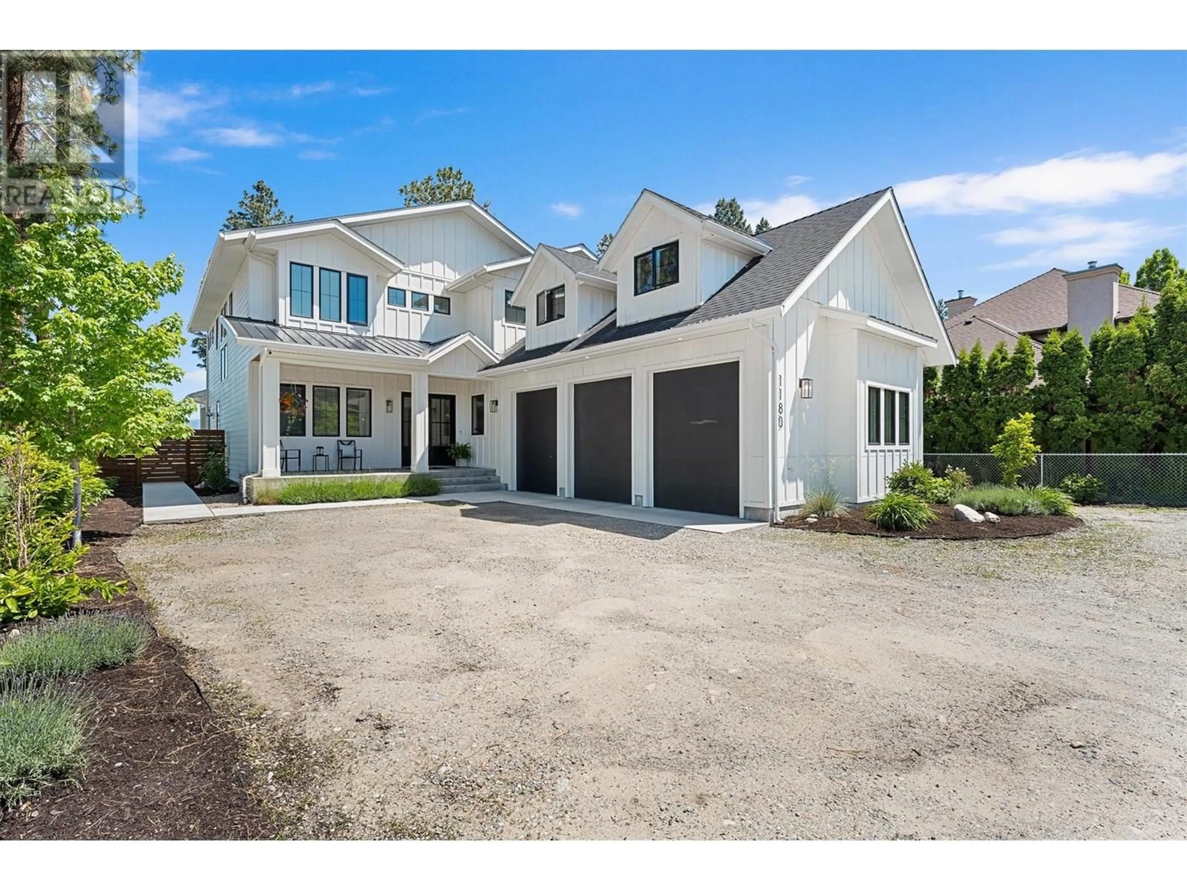 Home with vinyl exterior material, street for 1180 MISSION RIDGE ROAD, Kelowna British Columbia V1W3B2