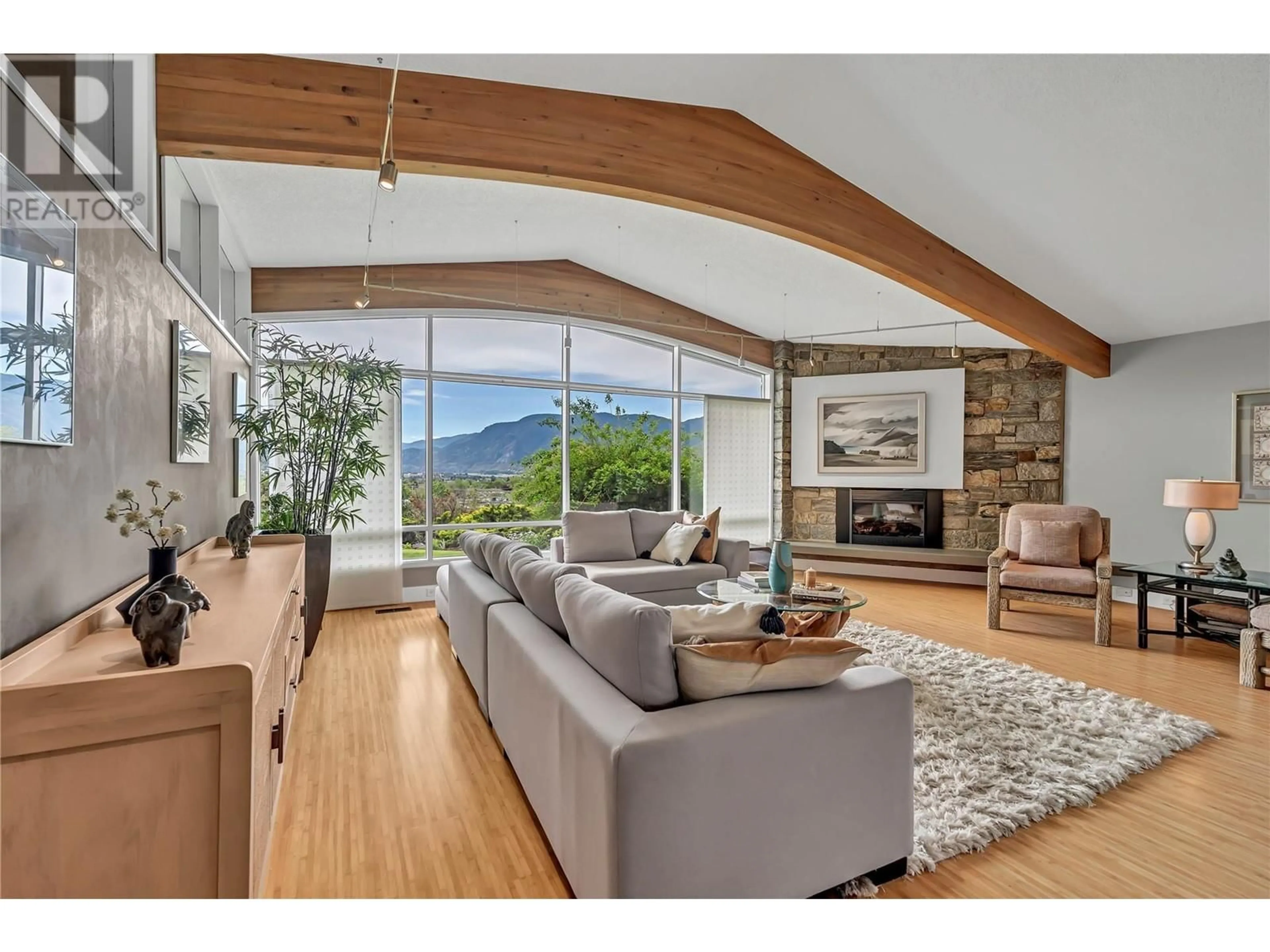 Living room with furniture, wood/laminate floor for 950 CREEKSIDE ROAD, Penticton British Columbia V2A2C4