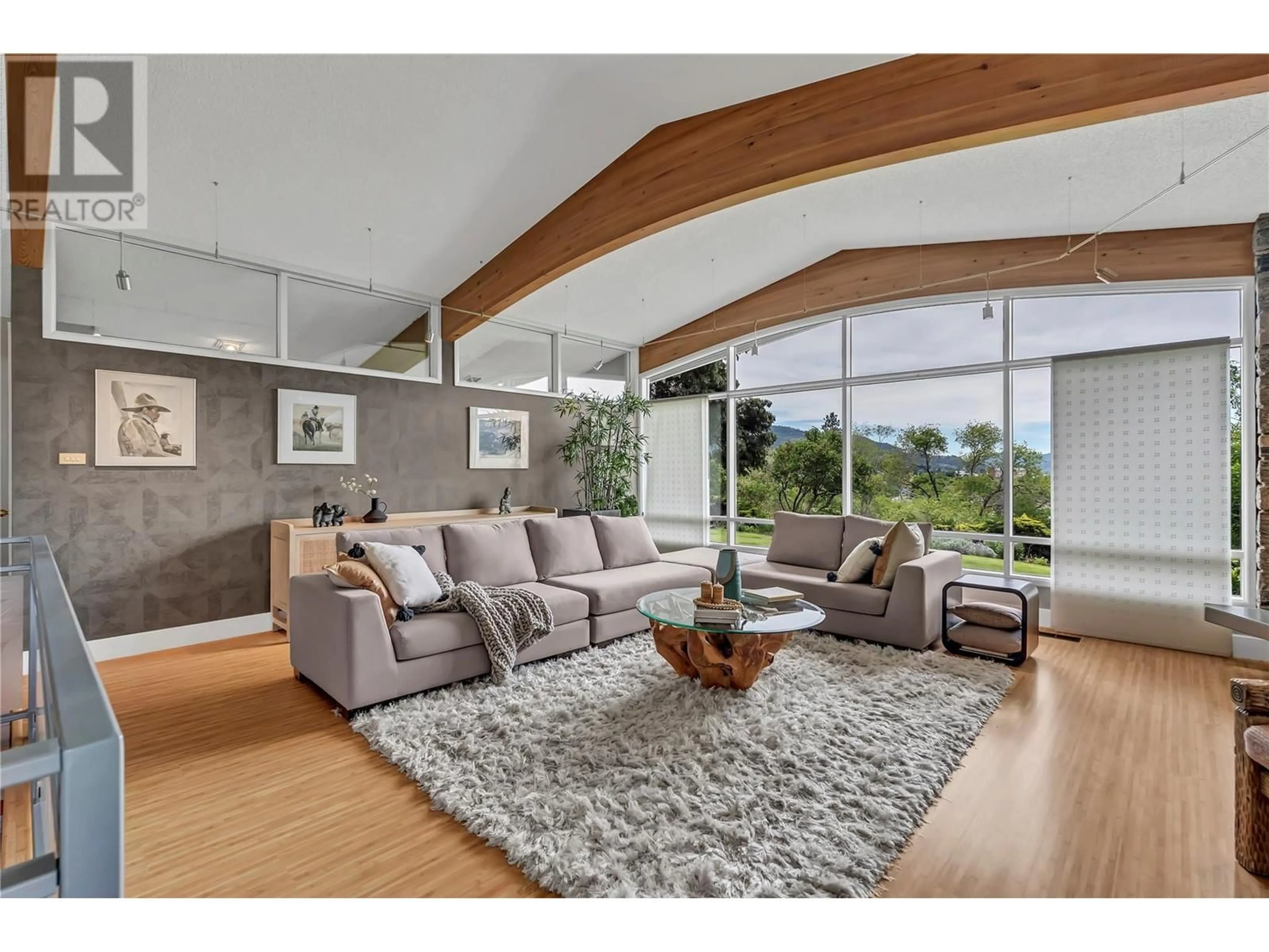 Living room with furniture, wood/laminate floor for 950 CREEKSIDE ROAD, Penticton British Columbia V2A2C4