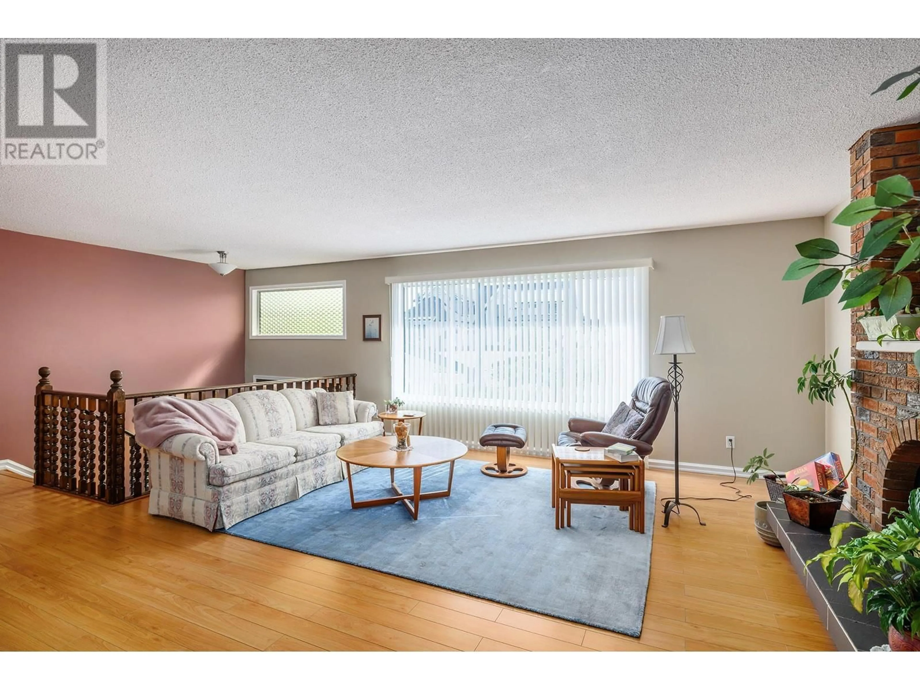 Living room with furniture, wood/laminate floor for 3070 THACKER DRIVE, West Kelowna British Columbia V1Z2V1