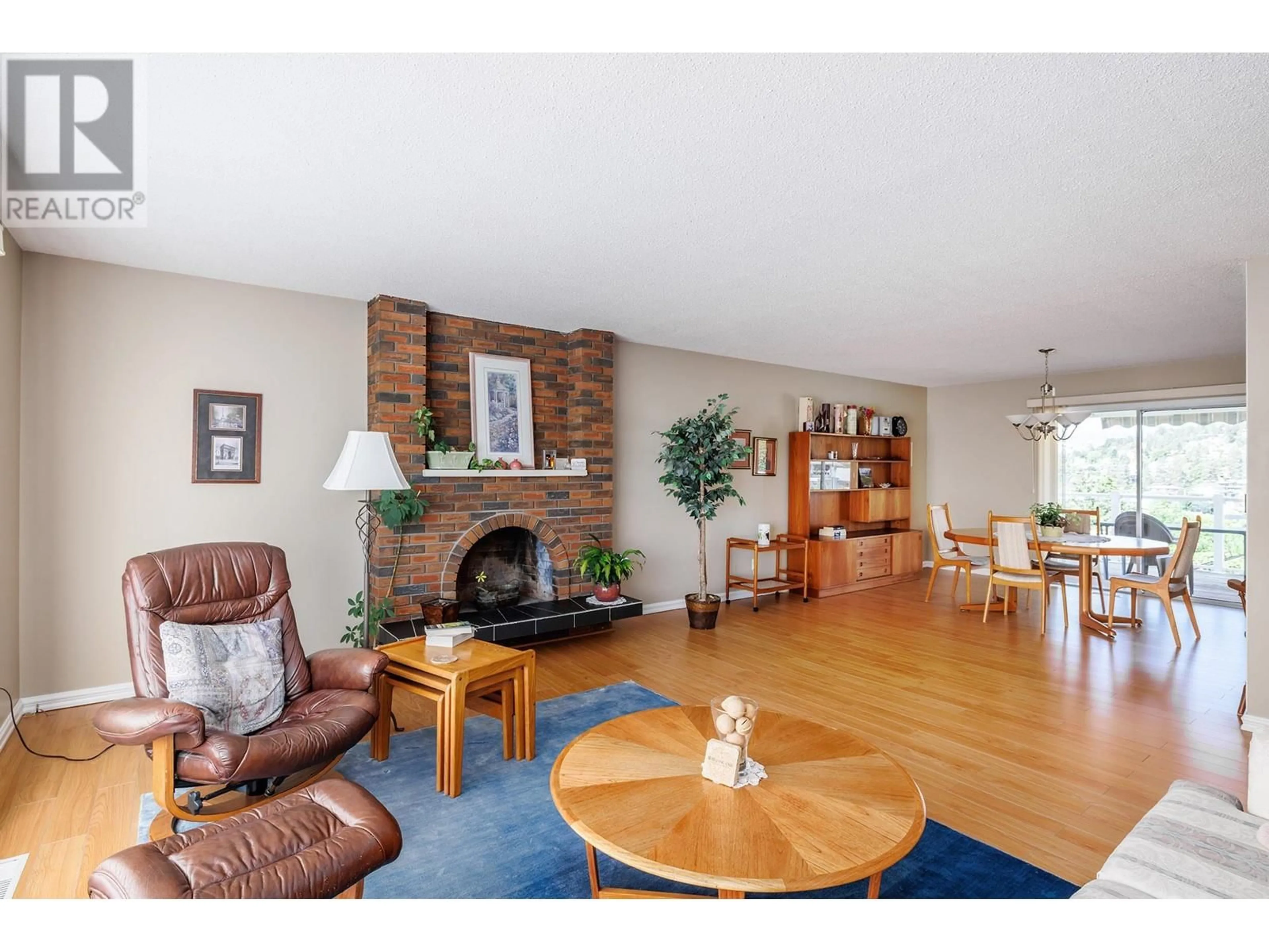 Living room with furniture, wood/laminate floor for 3070 THACKER DRIVE, West Kelowna British Columbia V1Z2V1