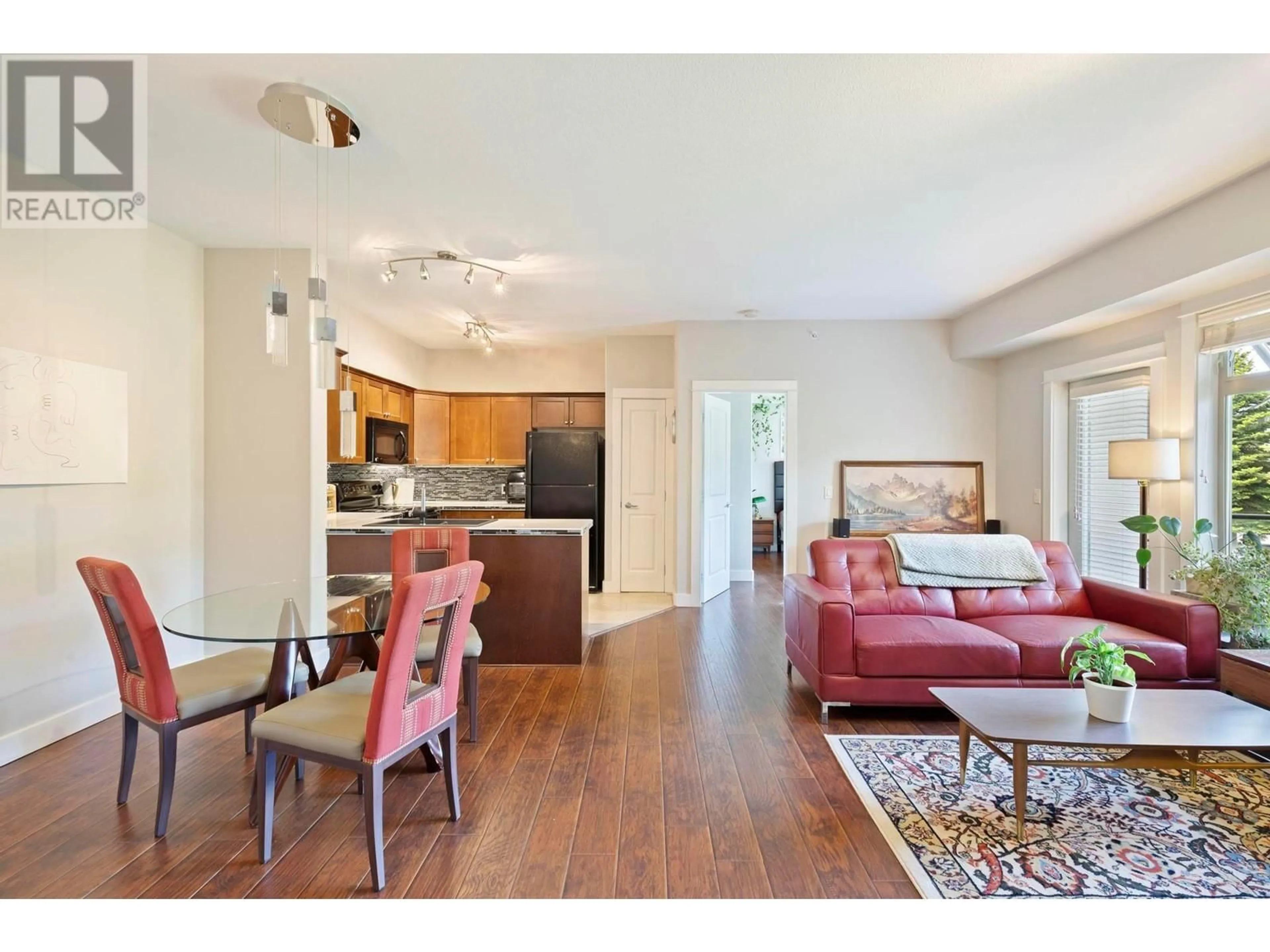 Living room with furniture, wood/laminate floor for 214 - 2611 STILLWATER WAY, Lake Country British Columbia V4V2R3