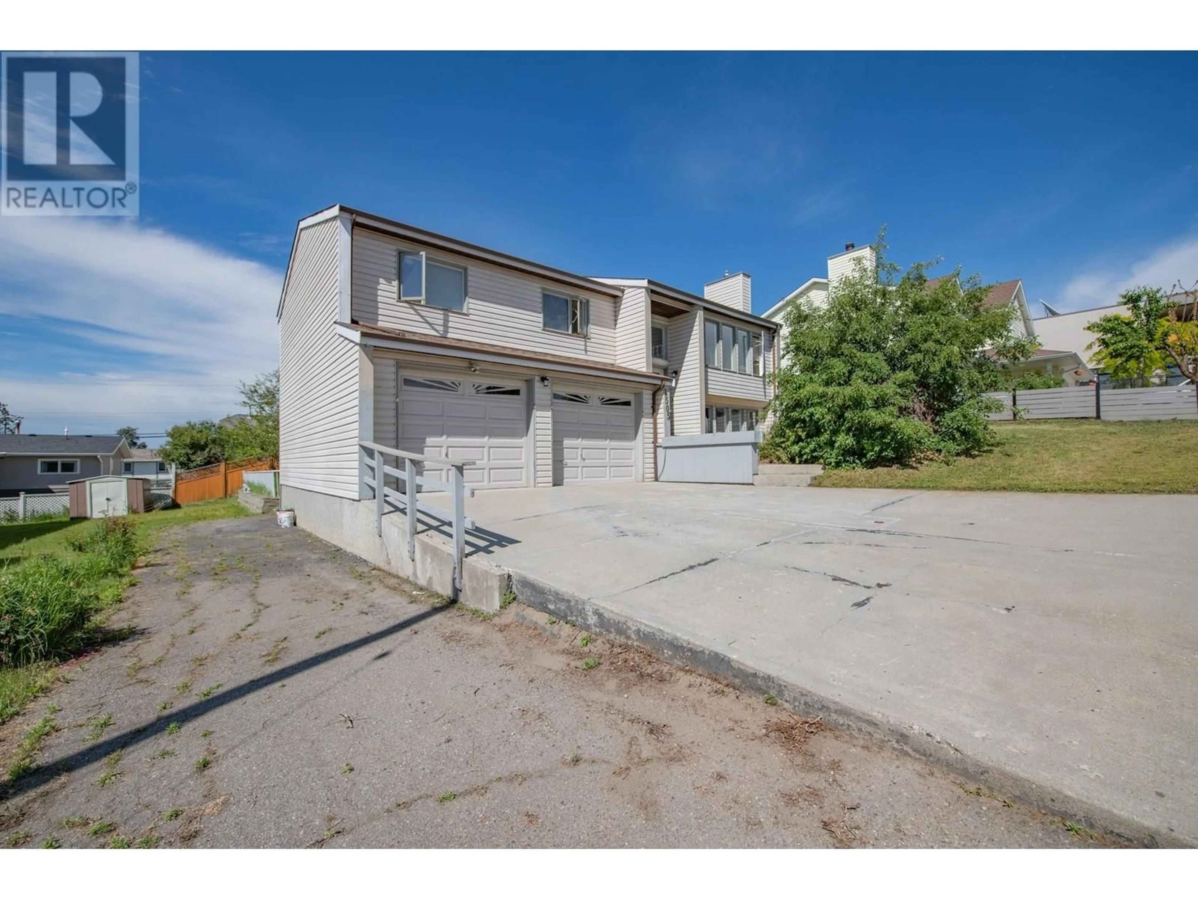 A pic from outside/outdoor area/front of a property/back of a property/a pic from drone, street for 1505 38 AVENUE, Vernon British Columbia V1T2Z1