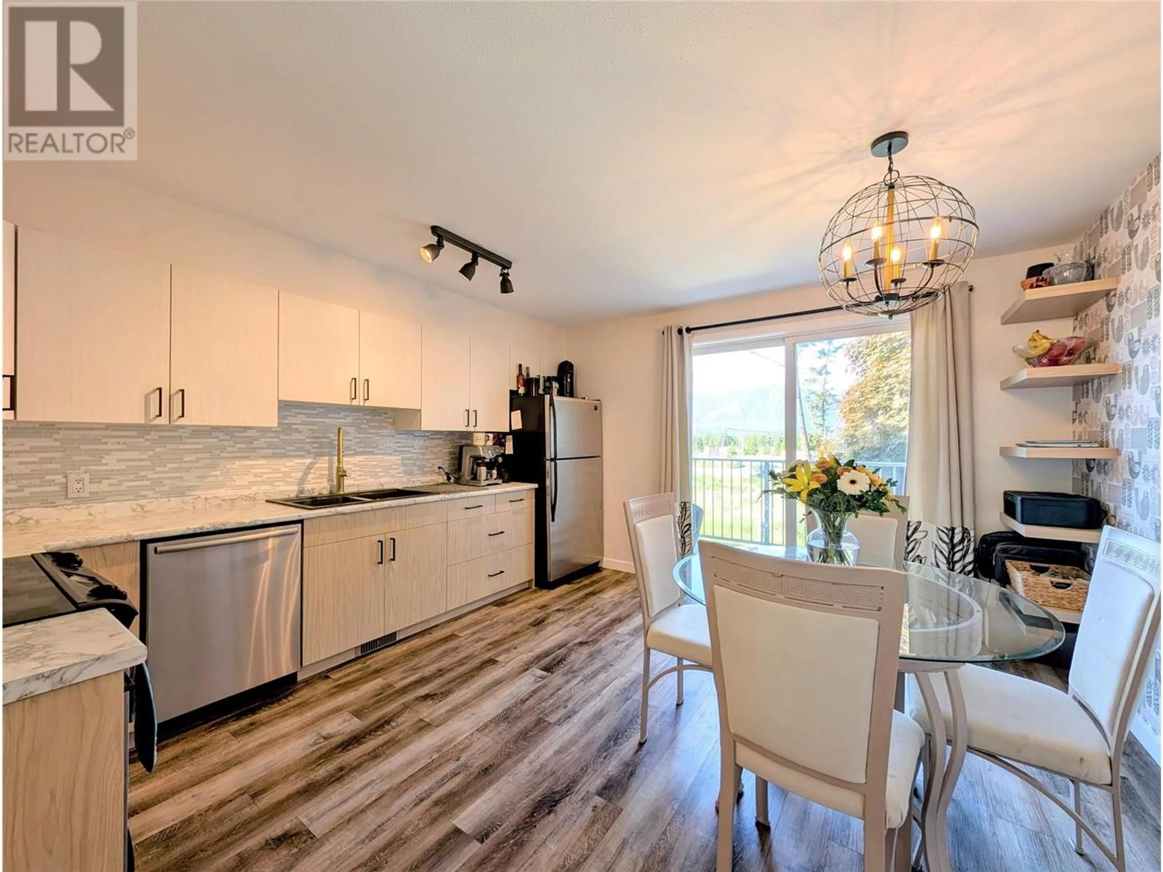 Open concept kitchen, wood/laminate floor for 704 - 200 BLACK FOREST TRAIL, Invermere British Columbia V0A1K2