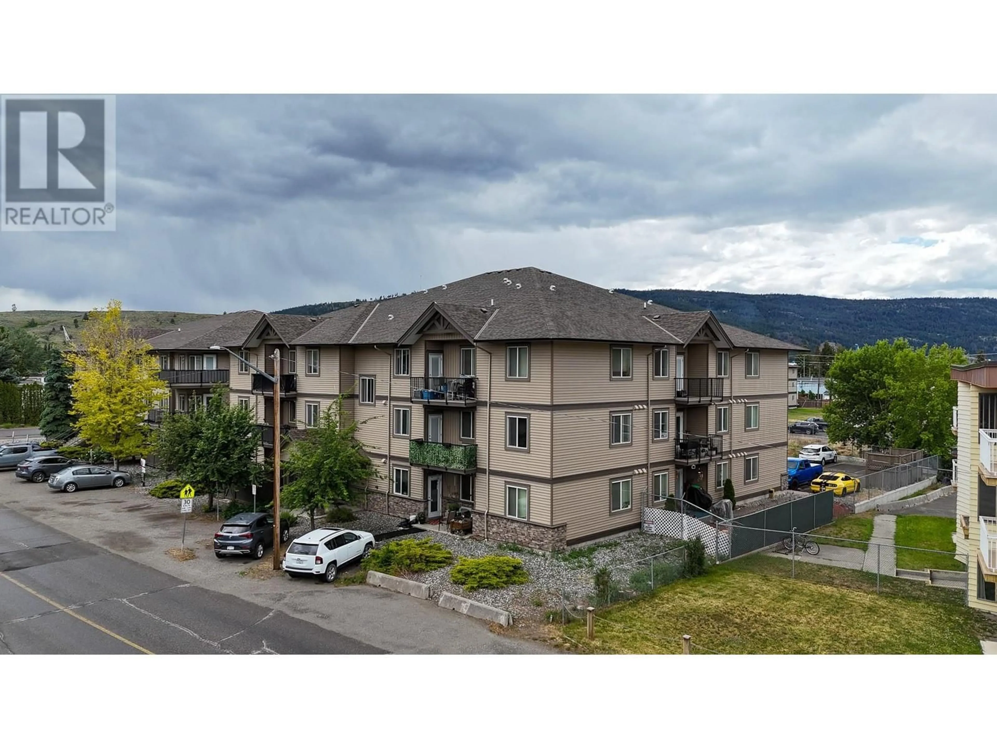 A pic from outside/outdoor area/front of a property/back of a property/a pic from drone, mountain view for 305 - 1701 MENZIES STREET, Merritt British Columbia V1K1A5