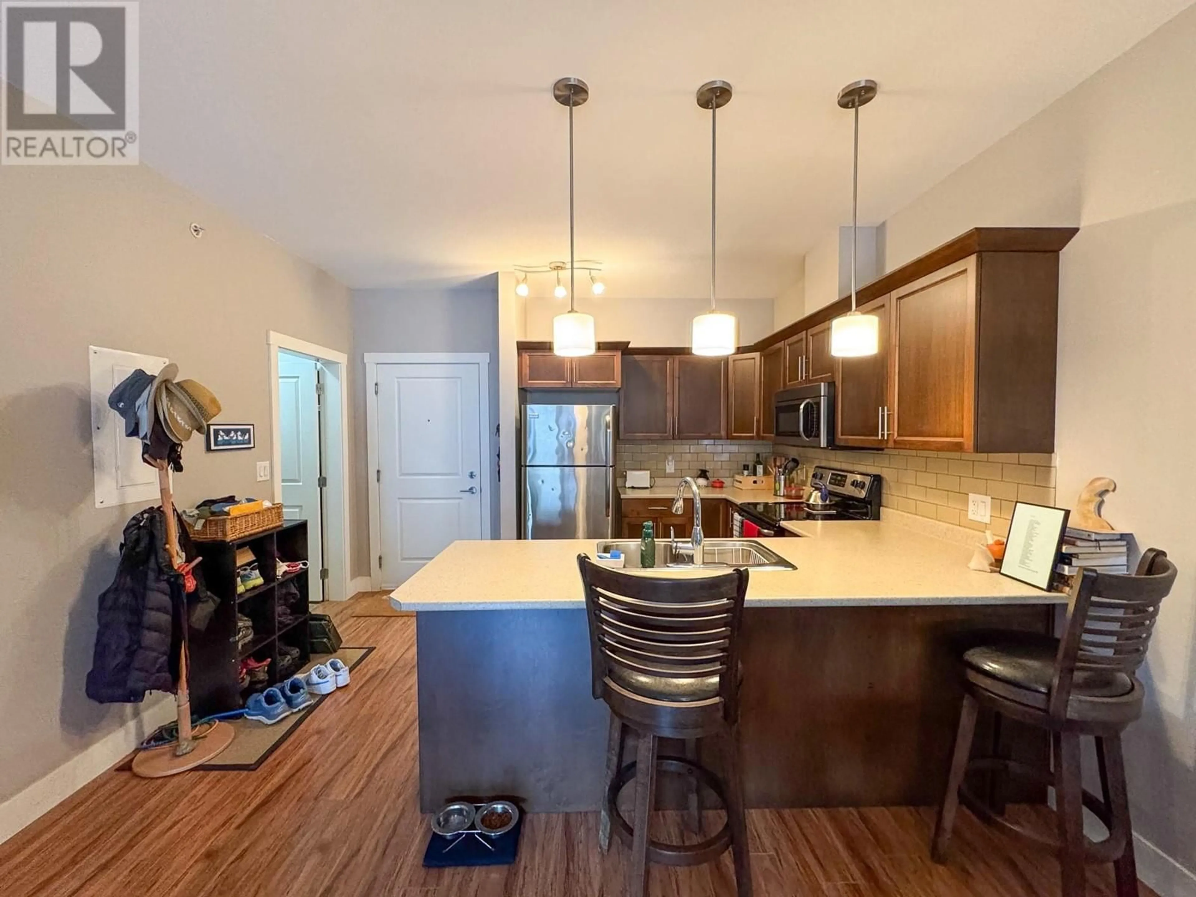 Open concept kitchen, wood/laminate floor for 305 - 1701 MENZIES STREET, Merritt British Columbia V1K1A5