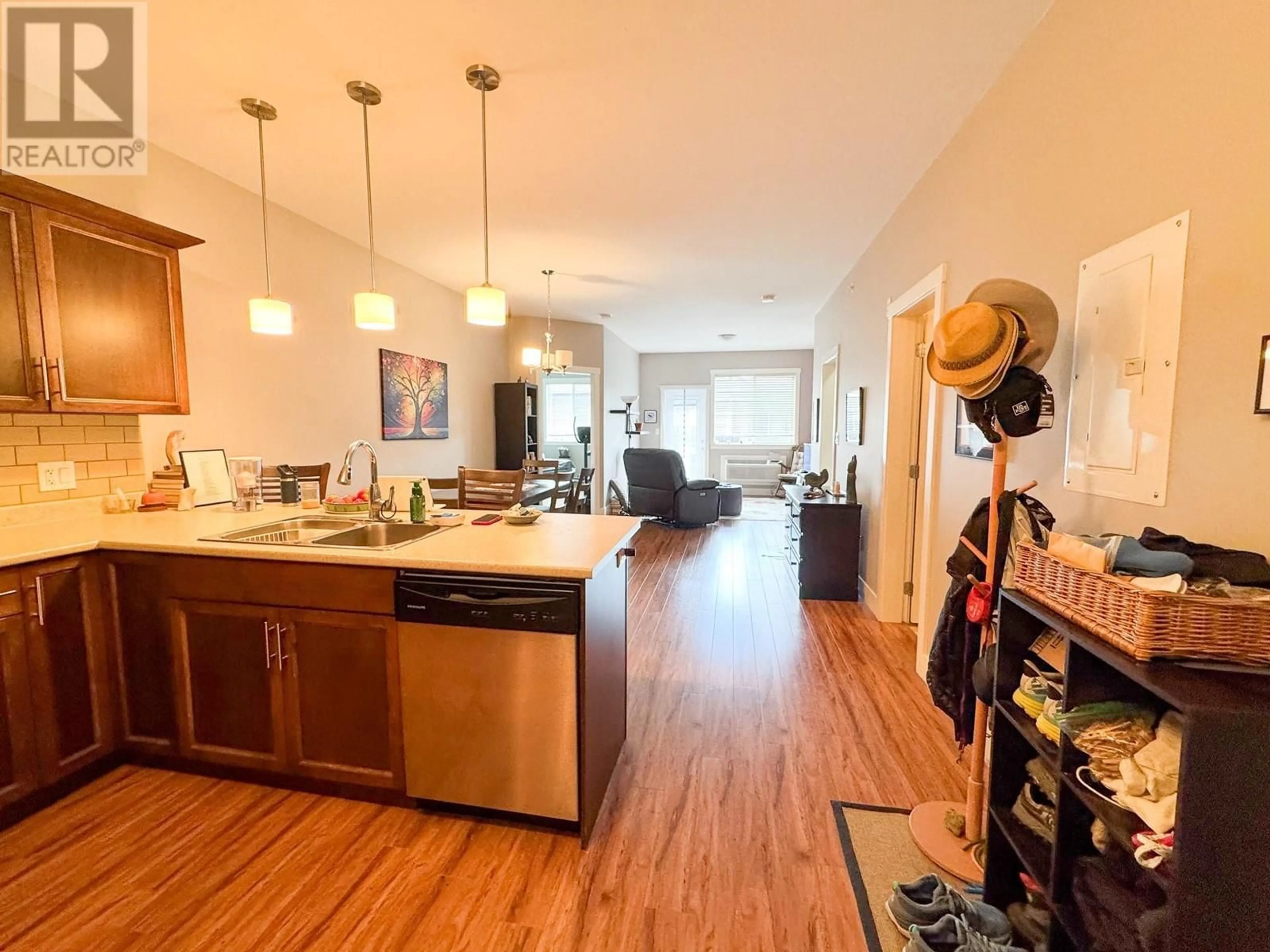Open concept kitchen, wood/laminate floor for 305 - 1701 MENZIES STREET, Merritt British Columbia V1K1A5