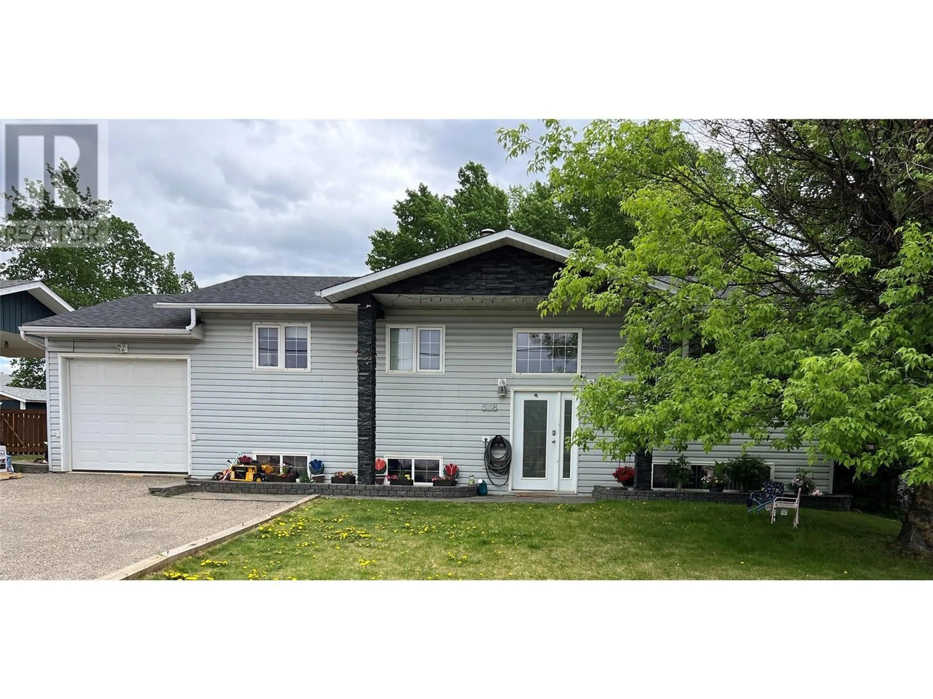 Home with vinyl exterior material, street for 5118 43A STREET NORTHEAST, Chetwynd British Columbia V0C1J0