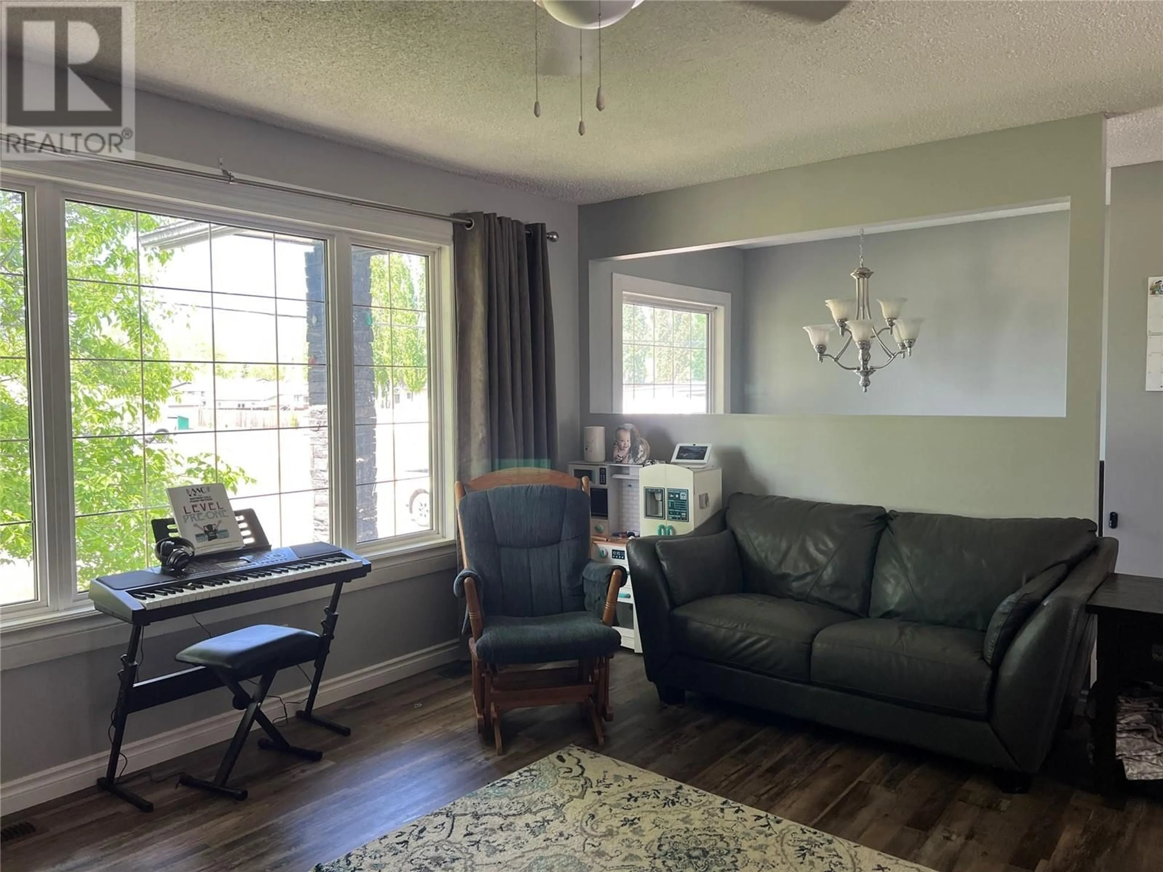 Living room with furniture, unknown for 5118 43A STREET NORTHEAST, Chetwynd British Columbia V0C1J0