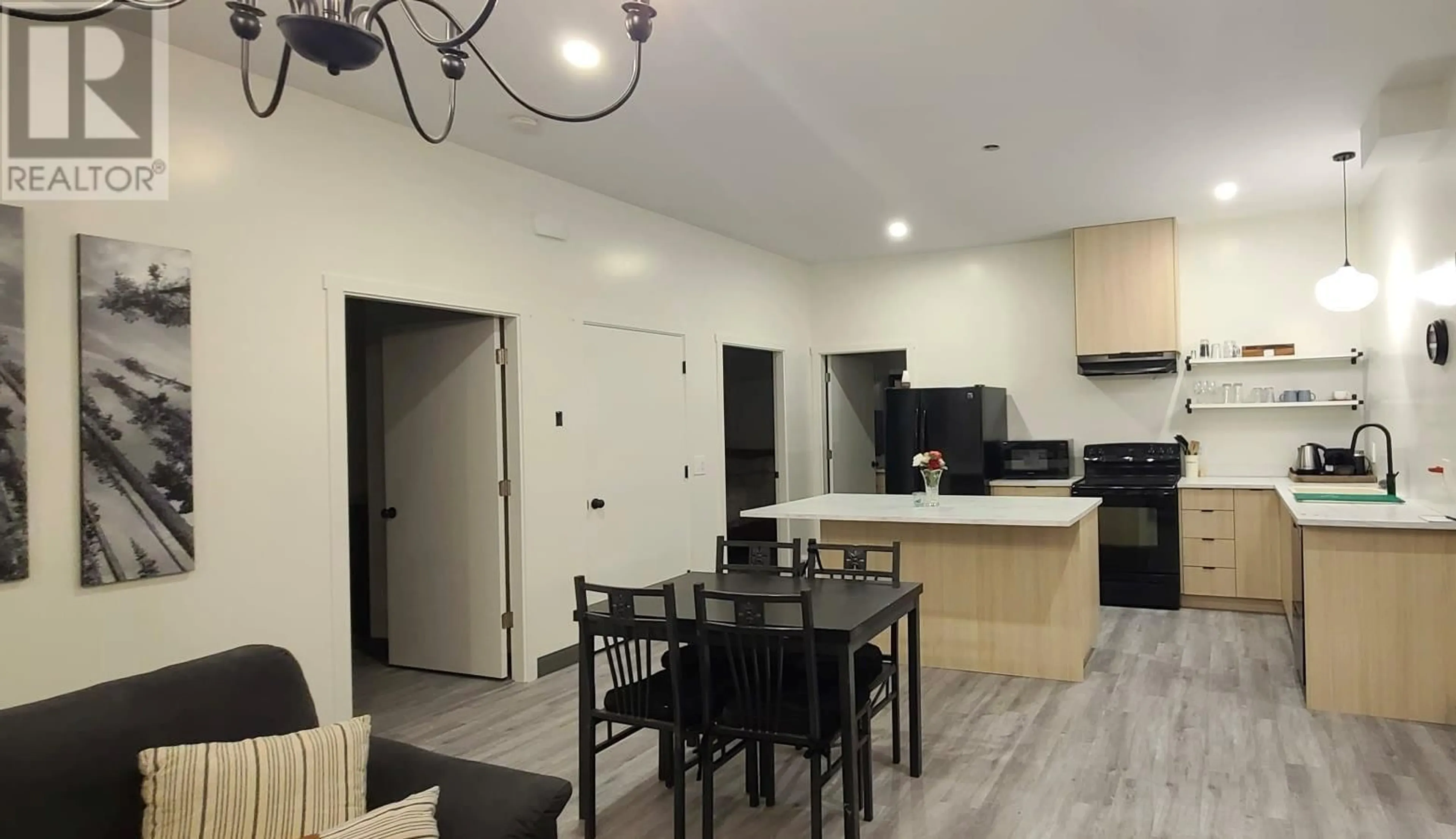 Open concept kitchen, wood/laminate floor for 6074 JACKSON CRESCENT, Peachland British Columbia V0H1X4