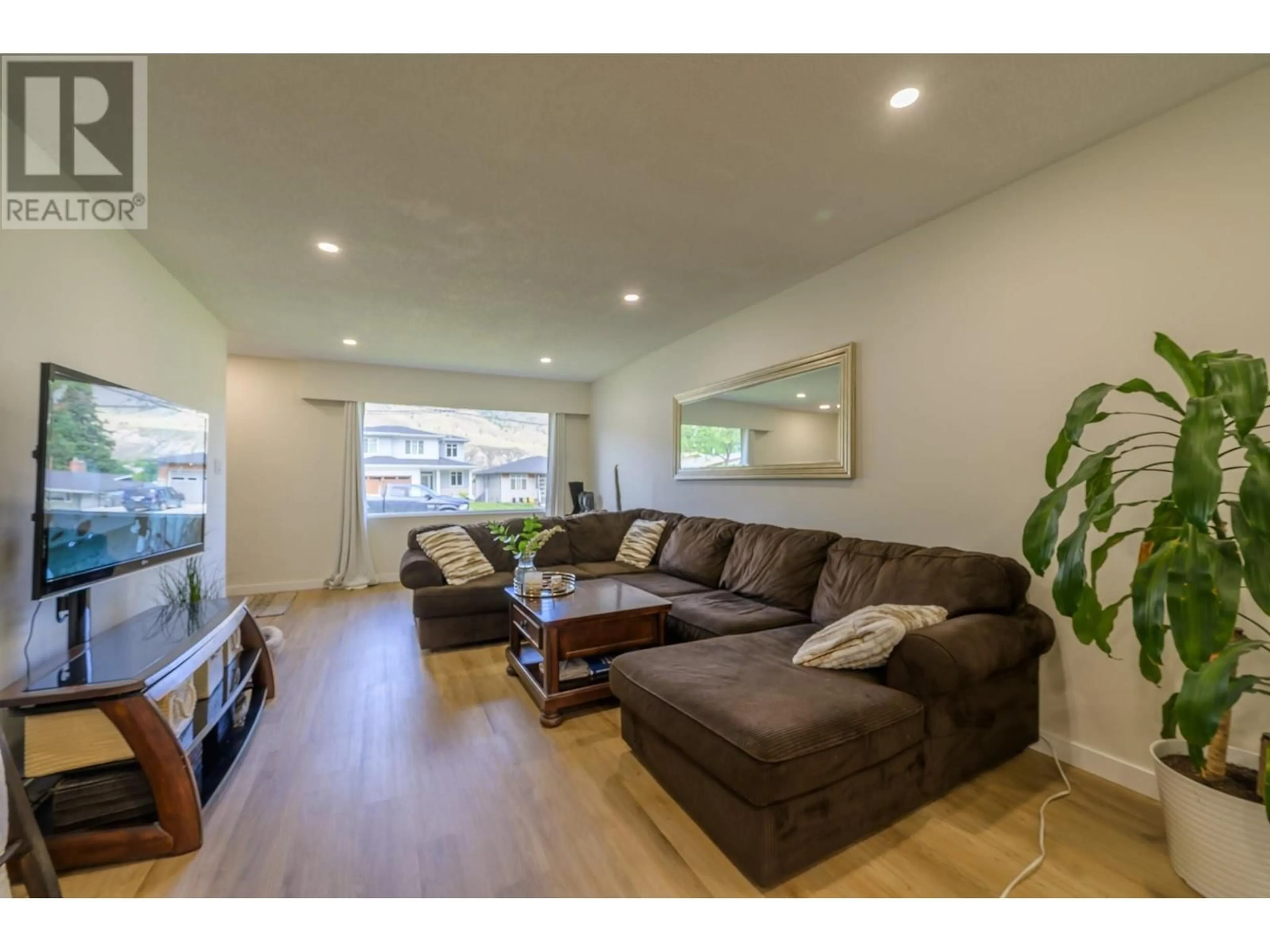 Living room with furniture, wood/laminate floor for 2257/2259 VALLEYVIEW DRIVE, Kamloops British Columbia V2C4C8