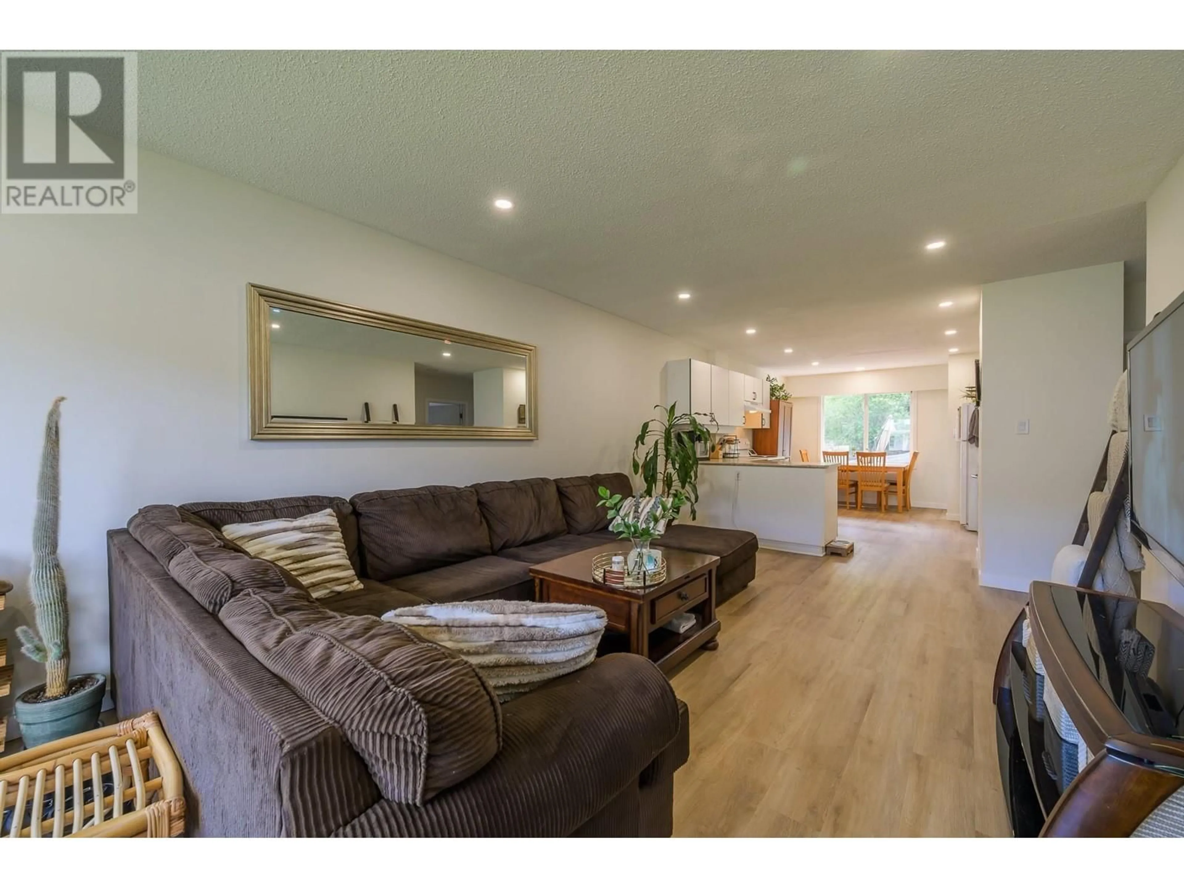 Living room with furniture, wood/laminate floor for 2257/2259 VALLEYVIEW DRIVE, Kamloops British Columbia V2C4C8