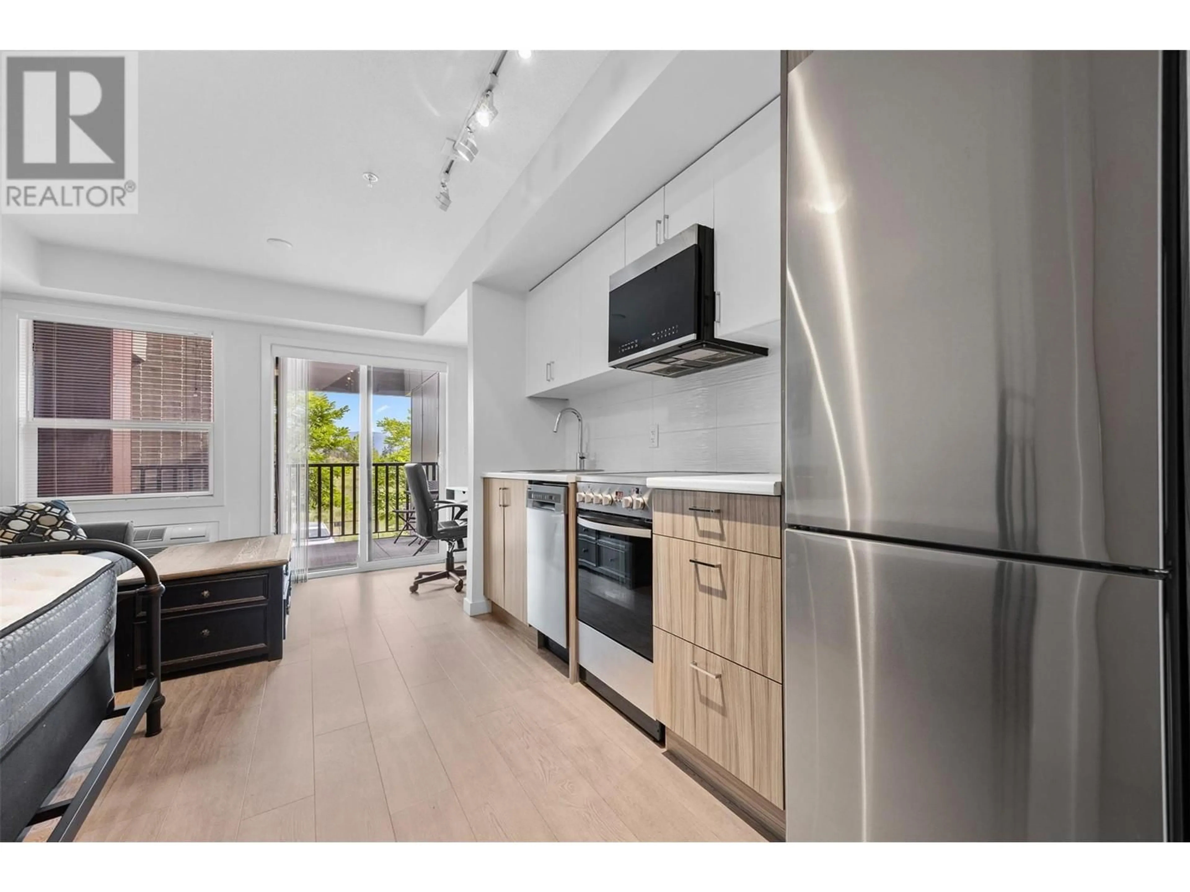 Open concept kitchen, unknown for 103 - 625 ACADEMY WAY, Kelowna British Columbia V1V0E3