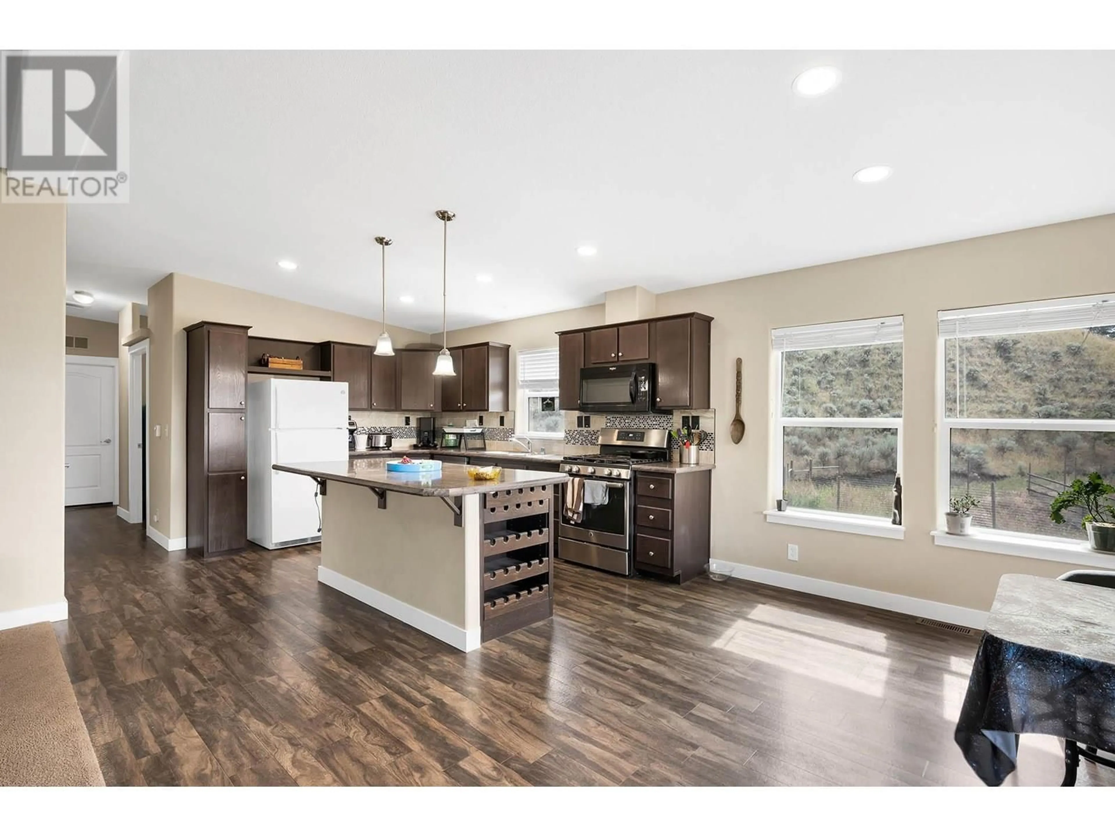 Open concept kitchen, wood/laminate floor for 840 DEER DRIVE, Kamloops British Columbia V1S1Z9
