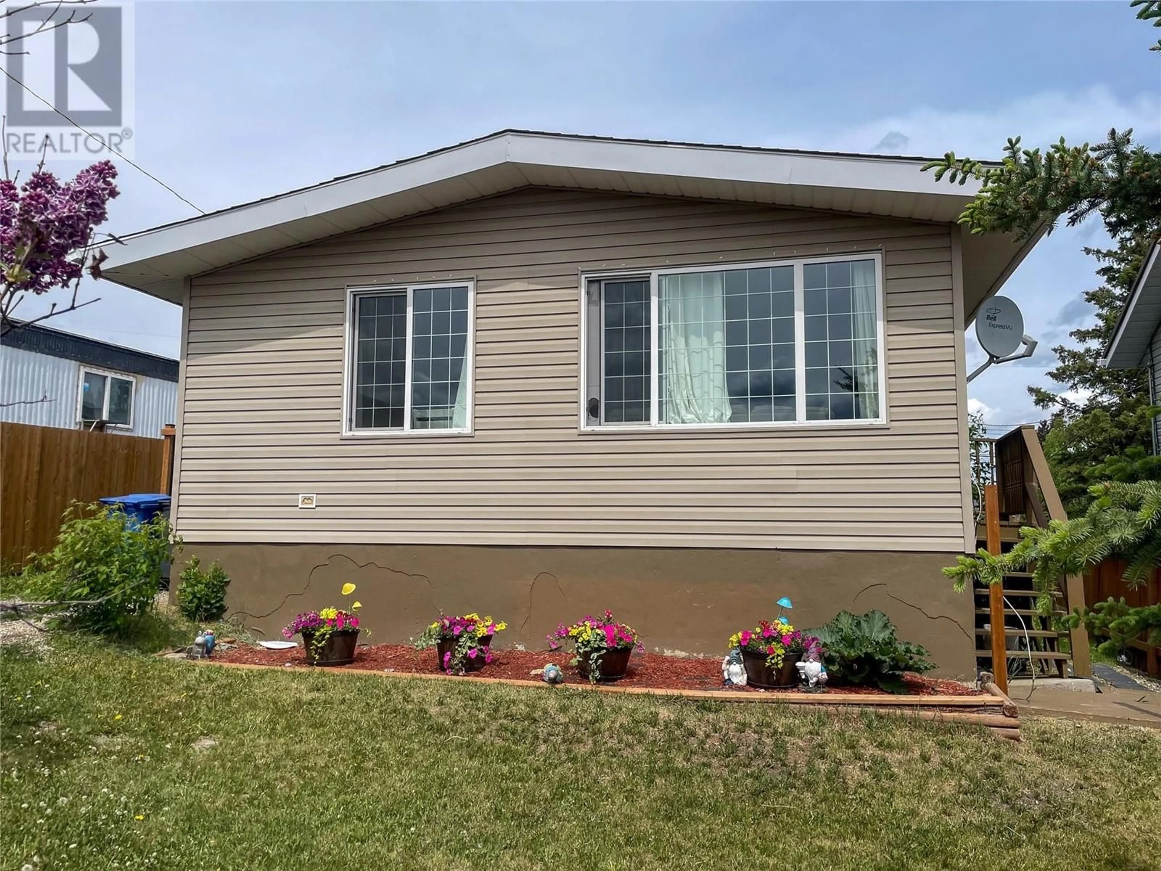 Home with vinyl exterior material, street for 4820 48 AVENUE, Pouce Coupe British Columbia V0C2C0