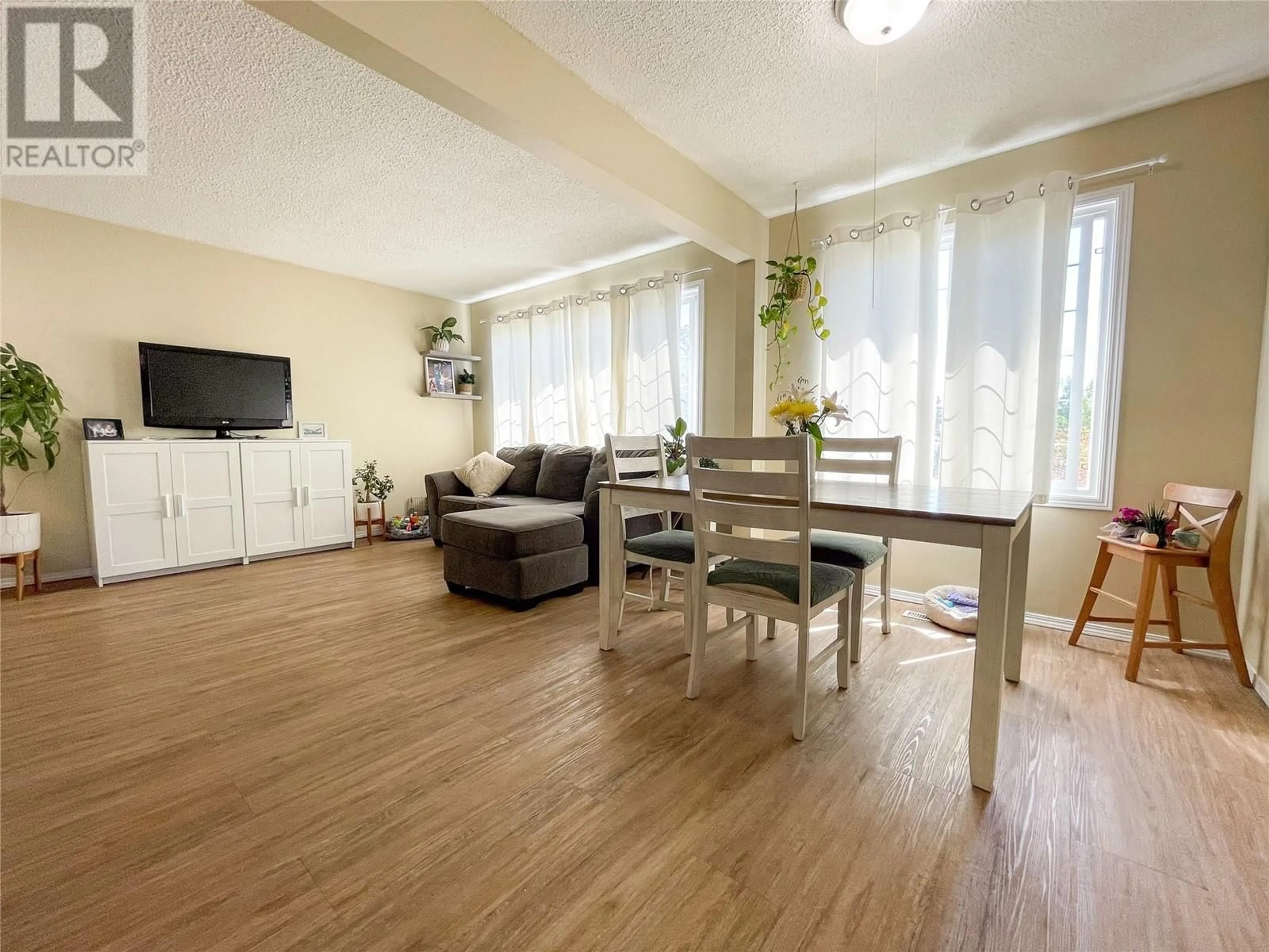 Living room with furniture, wood/laminate floor for 4820 48 AVENUE, Pouce Coupe British Columbia V0C2C0