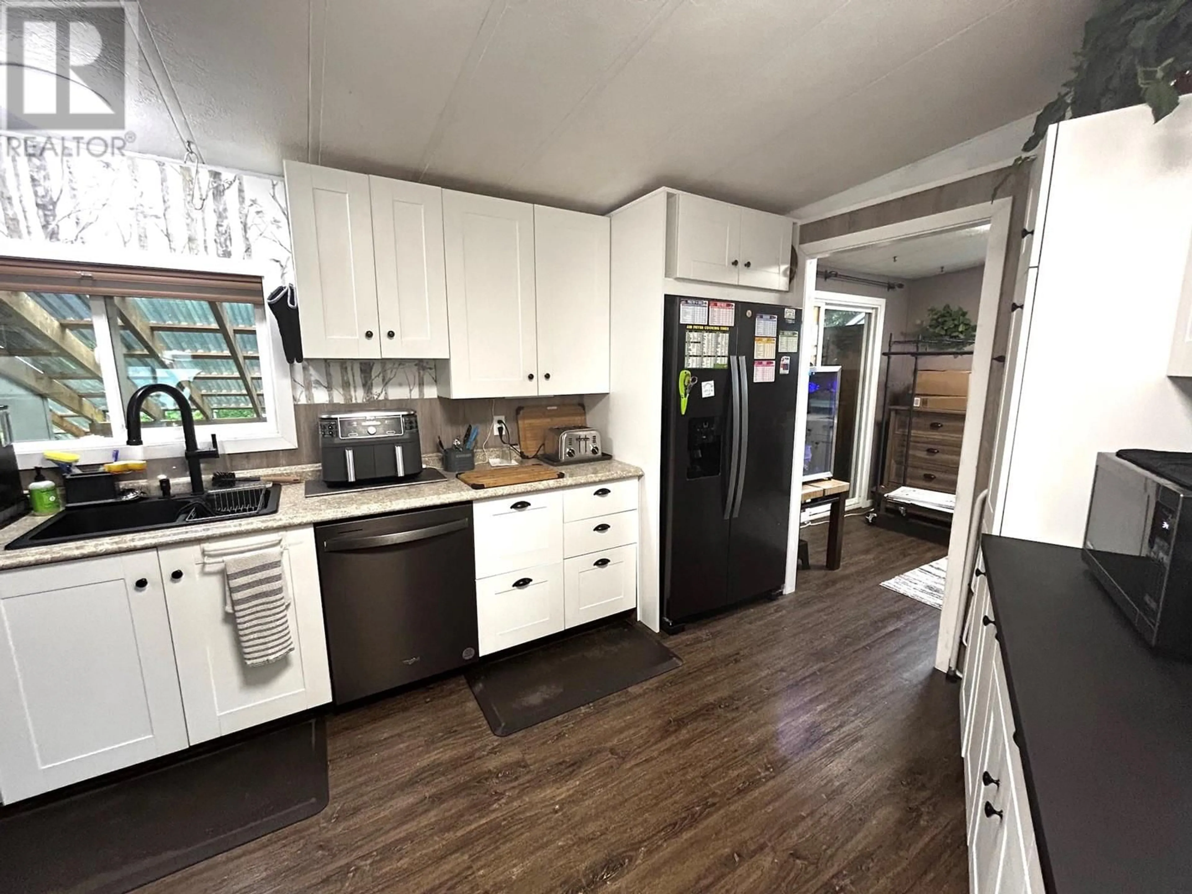 Open concept kitchen, wood/laminate floor for 2875 WILLOWDALE DRIVE, Armstrong British Columbia V0E1B1