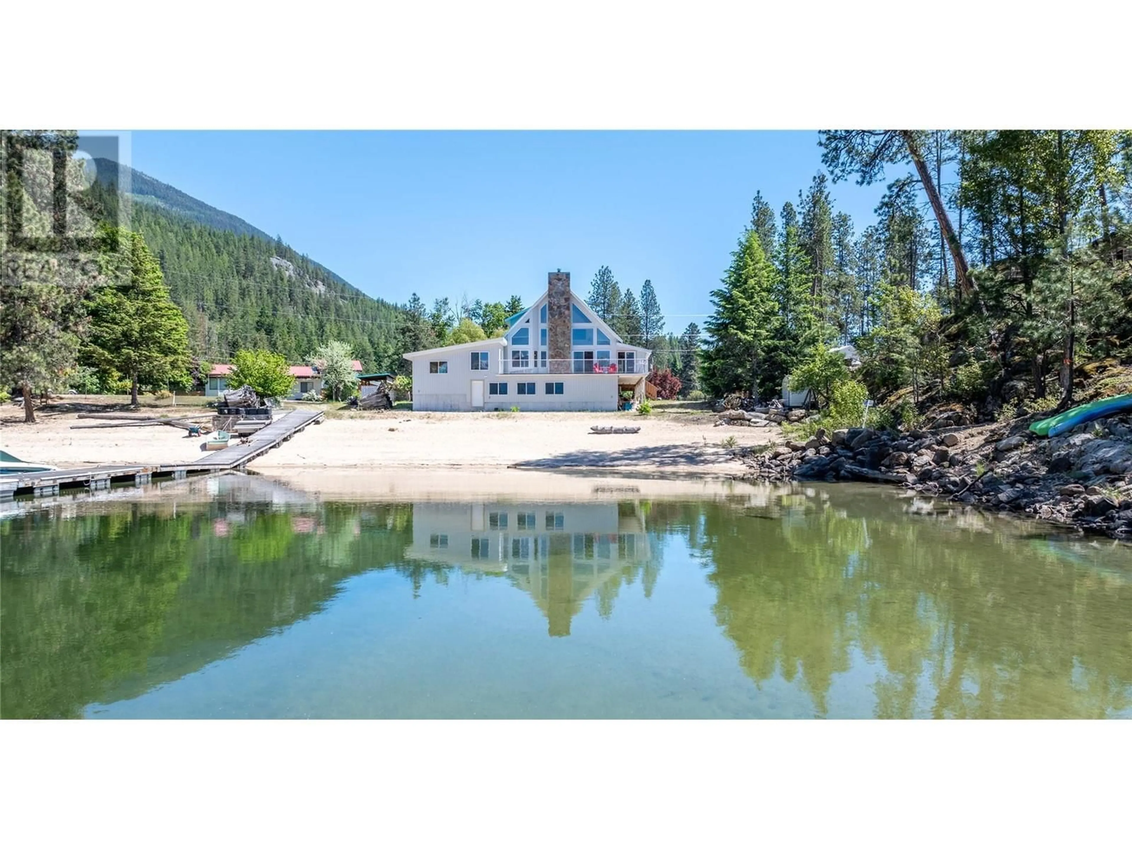 A pic from outside/outdoor area/front of a property/back of a property/a pic from drone, water/lake/river/ocean view for 10265 TWIN BAYS ROAD, Kuskanook British Columbia V0B1A1