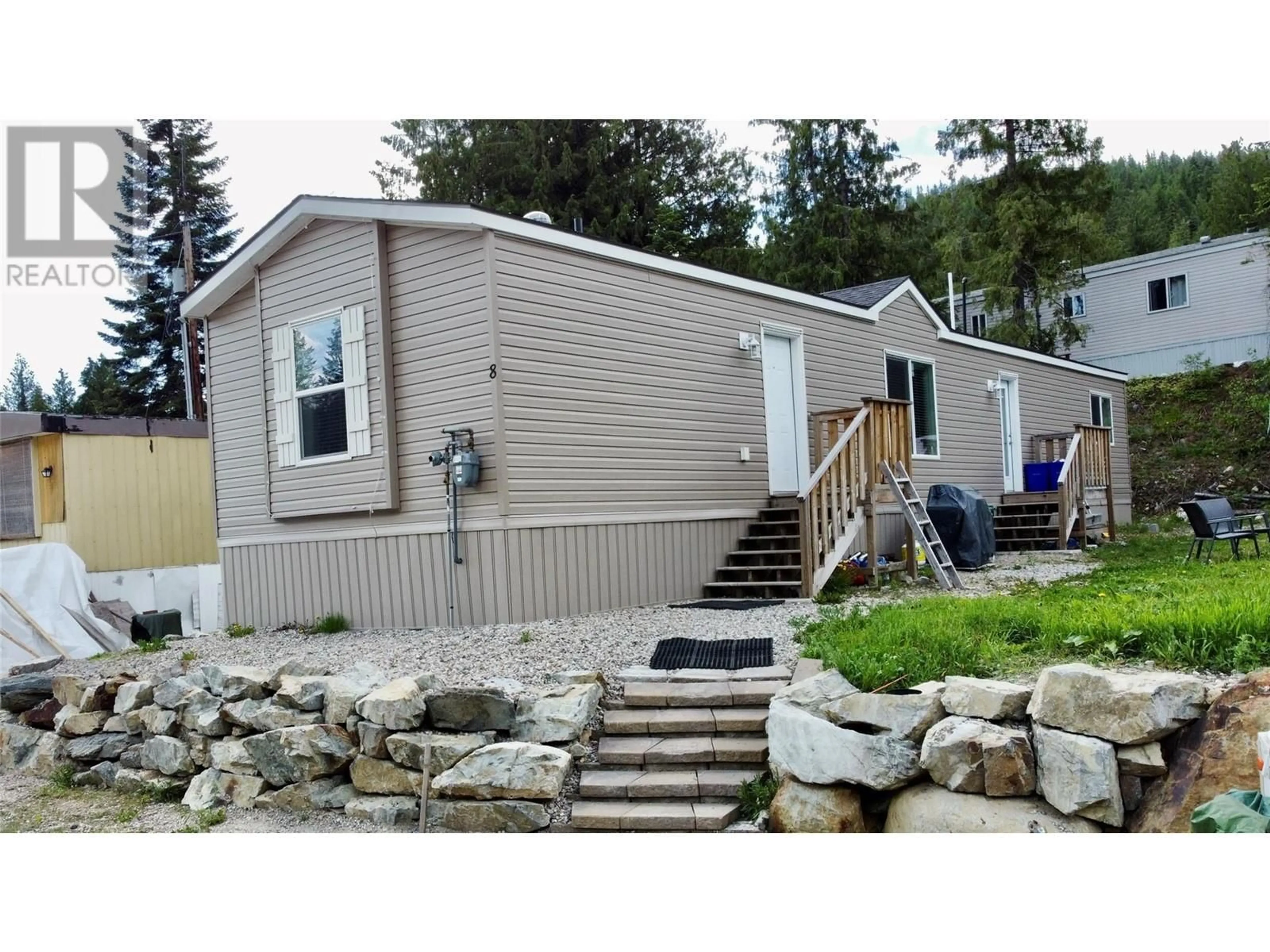 Home with vinyl exterior material, street for 8 - 891 MONTE VISTA DRIVE, Rossland British Columbia V0G1Y0