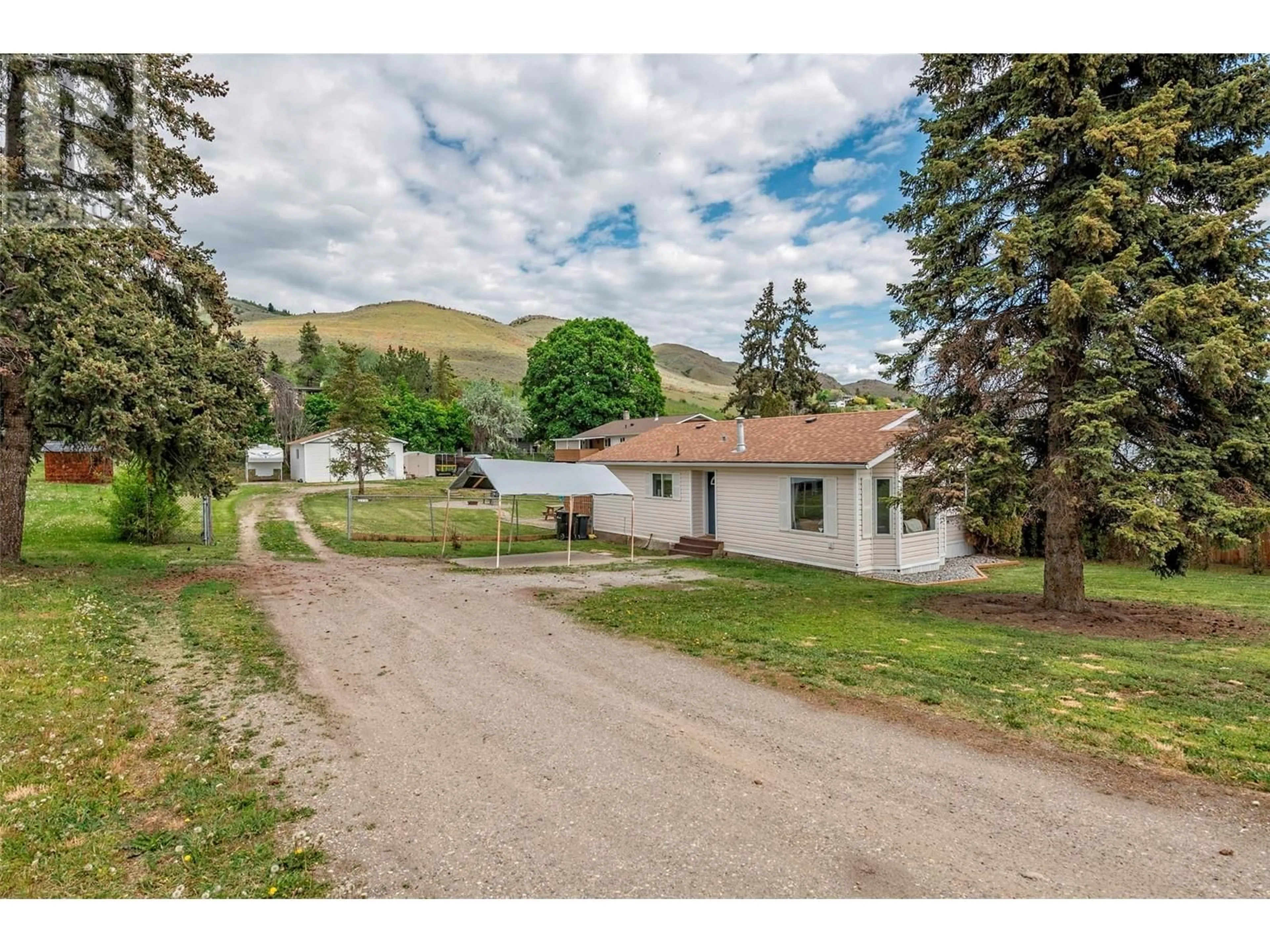 A pic from outside/outdoor area/front of a property/back of a property/a pic from drone, mountain view for 6111 BELLA VISTA ROAD, Vernon British Columbia V1H1B4