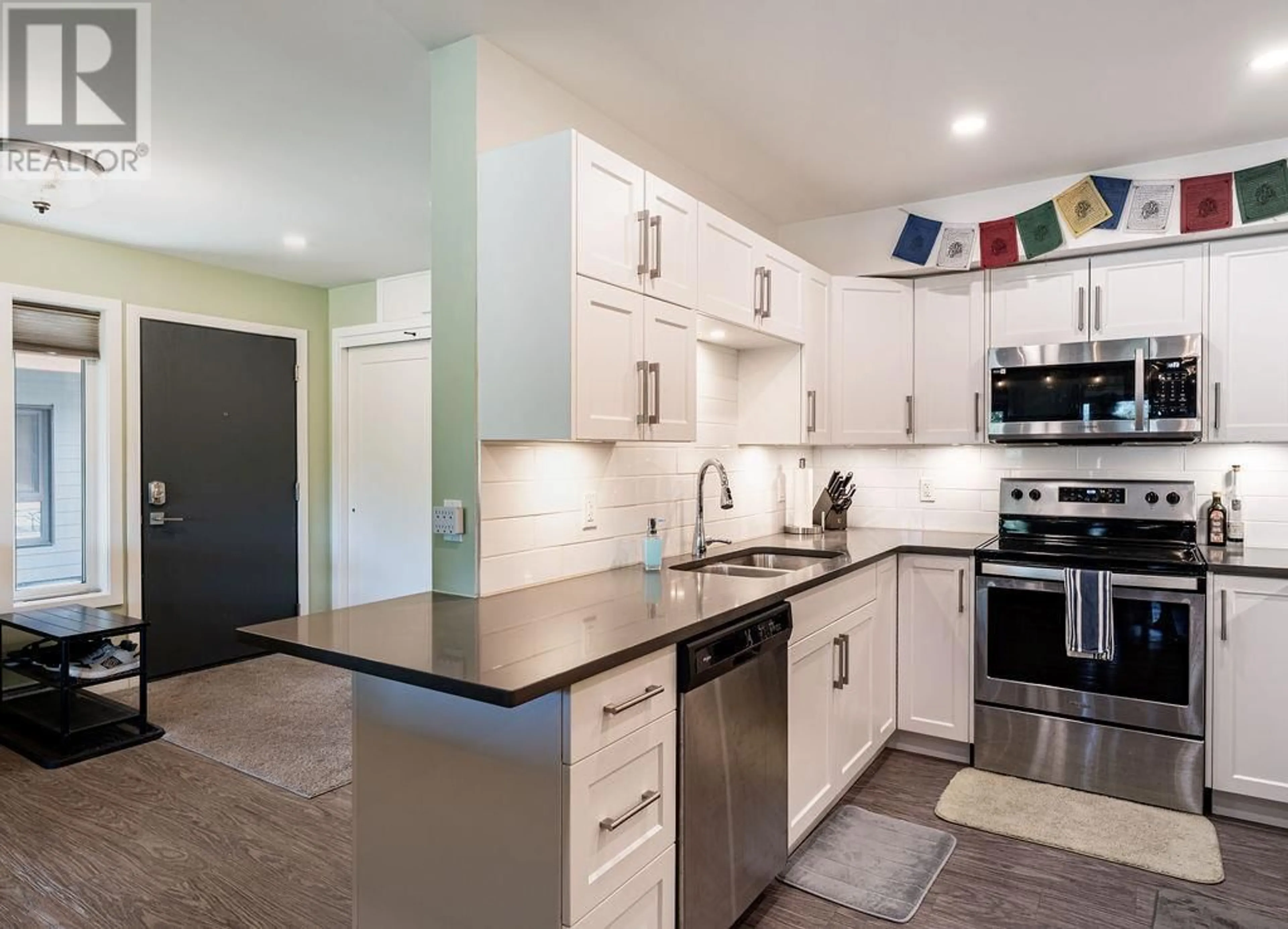 Open concept kitchen, ceramic/tile floor for 2100 - 1901 NELS NELSON CRESCENT, Revelstoke British Columbia V0E2S3