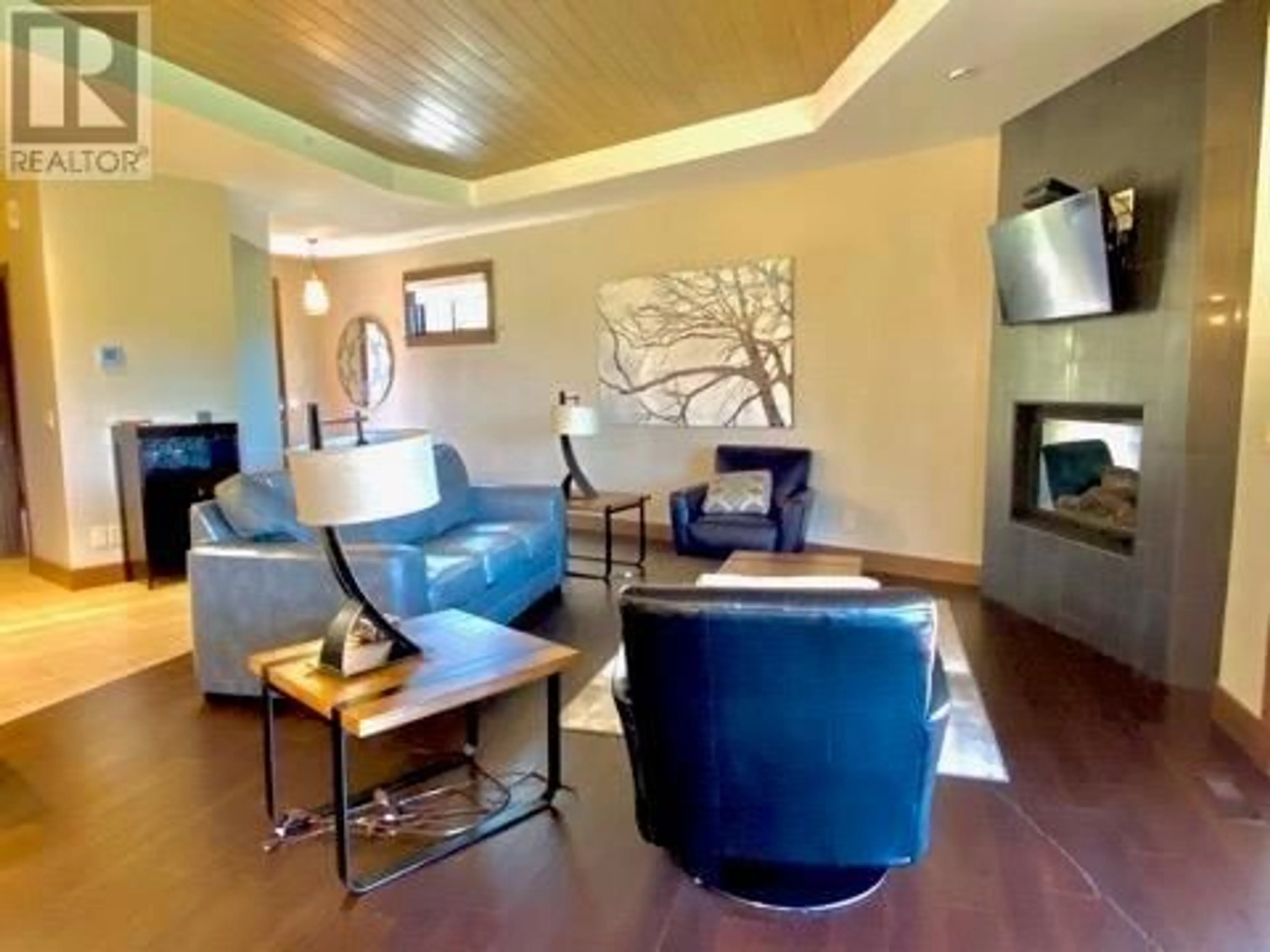 Living room with furniture, wood/laminate floor for 4G - 101 DORMIE DRIVE, Vernon British Columbia V1H1Y6