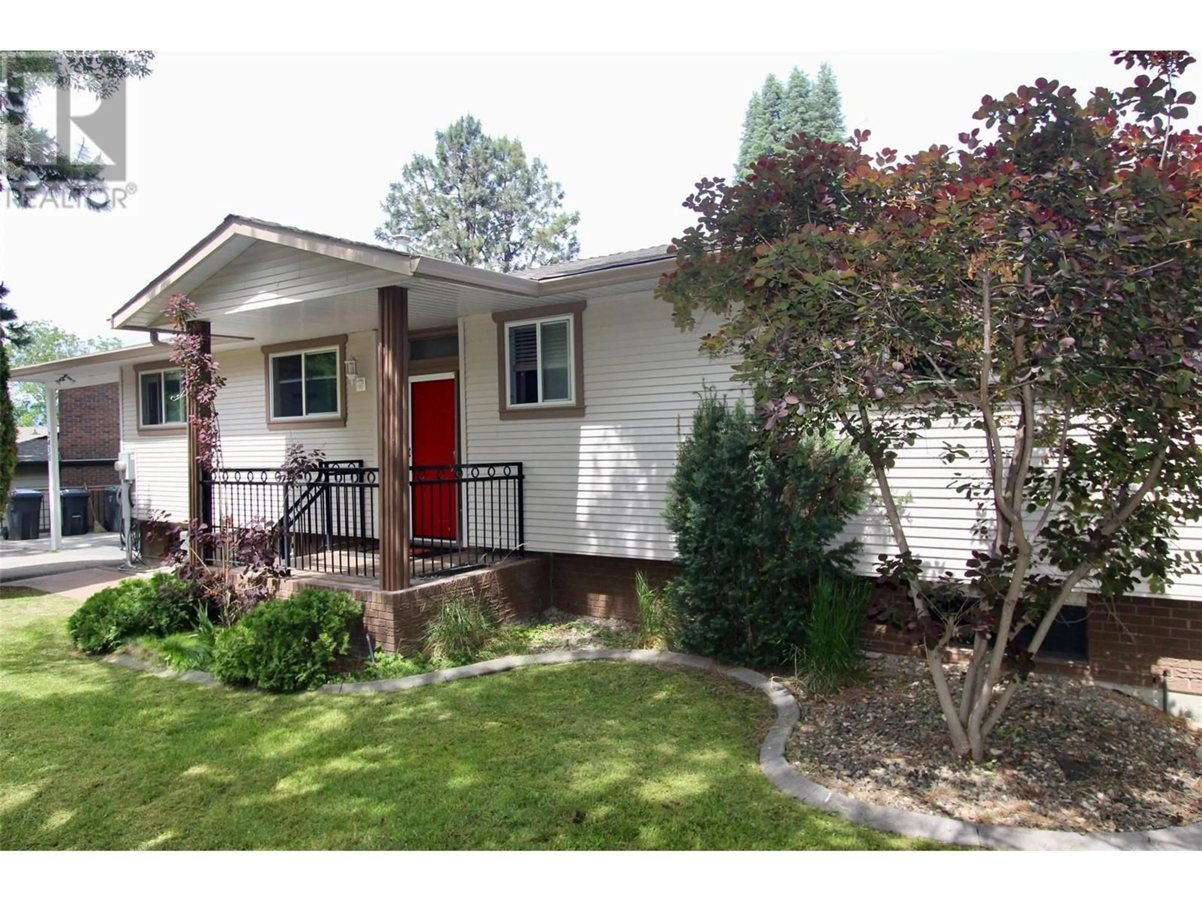 Home with vinyl exterior material, street for 2430 FAIRHALL ROAD, Kelowna British Columbia V1W2W2
