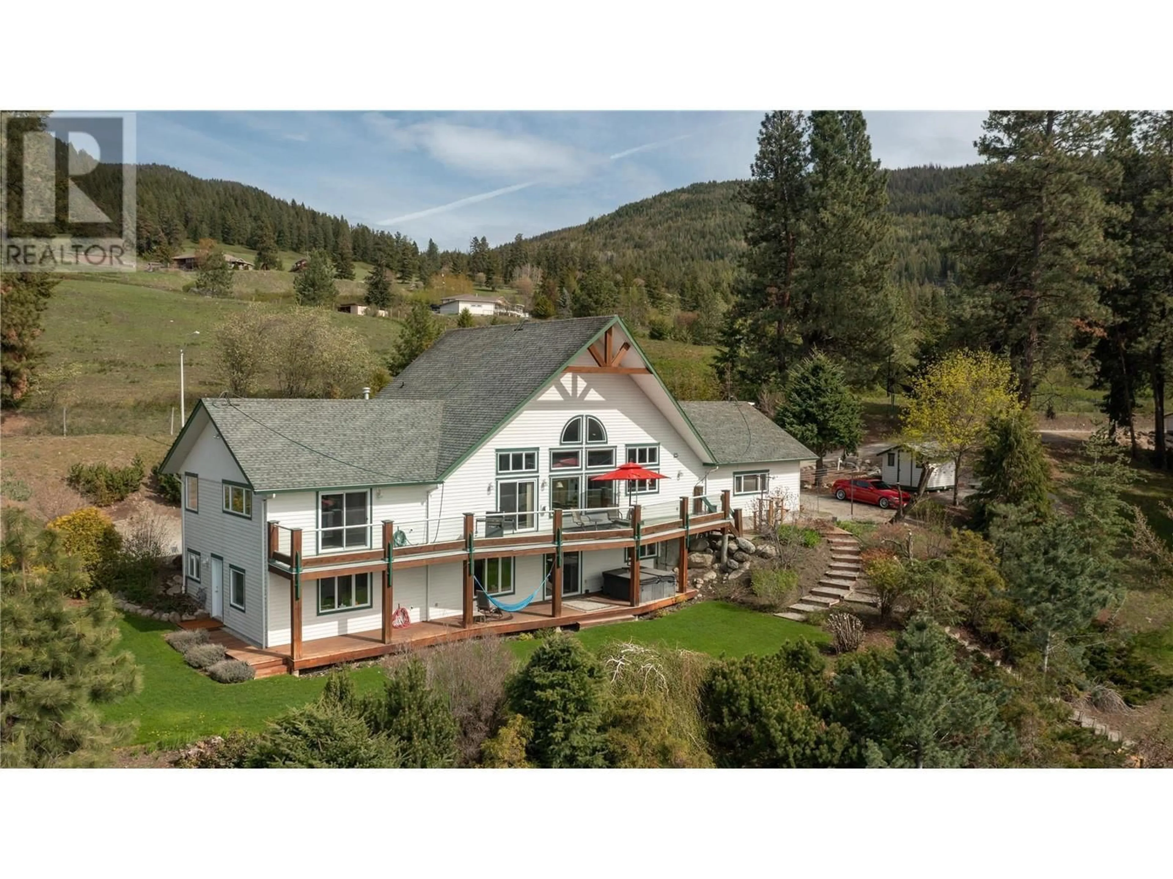 A pic from outside/outdoor area/front of a property/back of a property/a pic from drone, mountain view for 6435 DIXON DAM ROAD, Vernon British Columbia V1B3J9