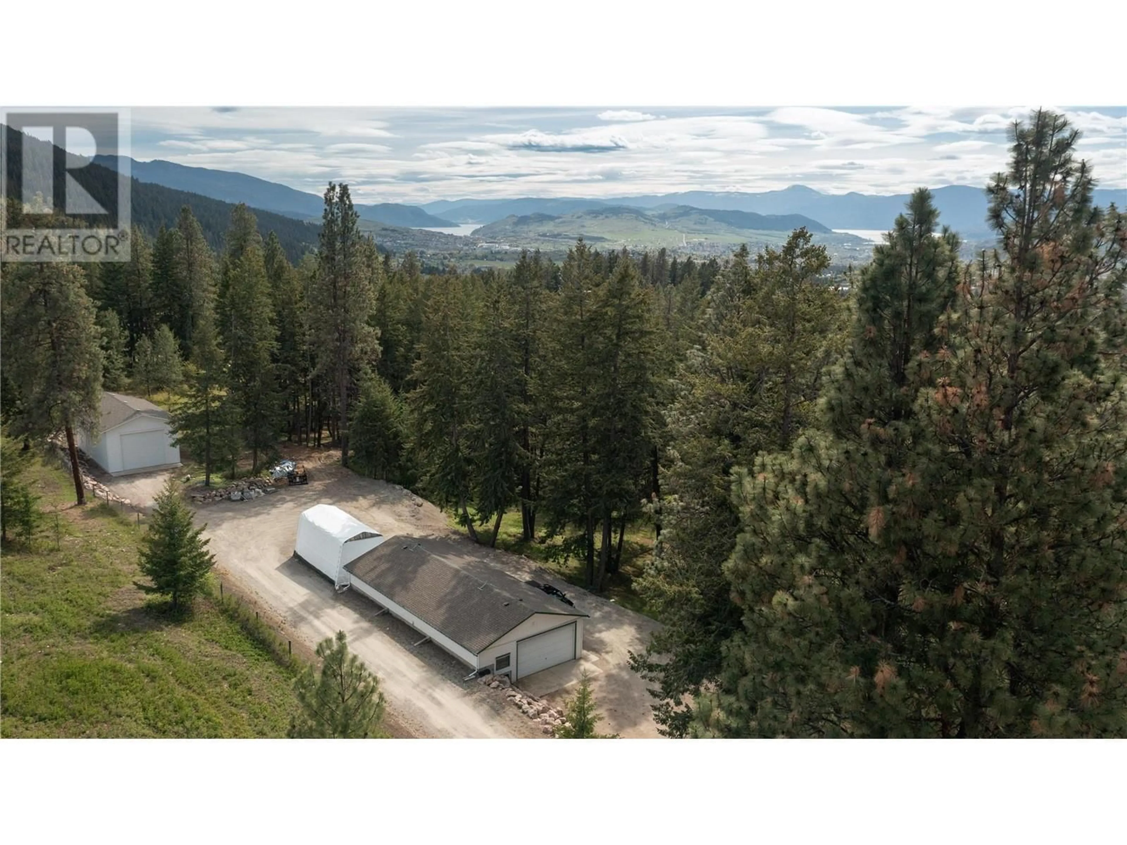 A pic from outside/outdoor area/front of a property/back of a property/a pic from drone, mountain view for 6435 DIXON DAM ROAD, Vernon British Columbia V1B3J9