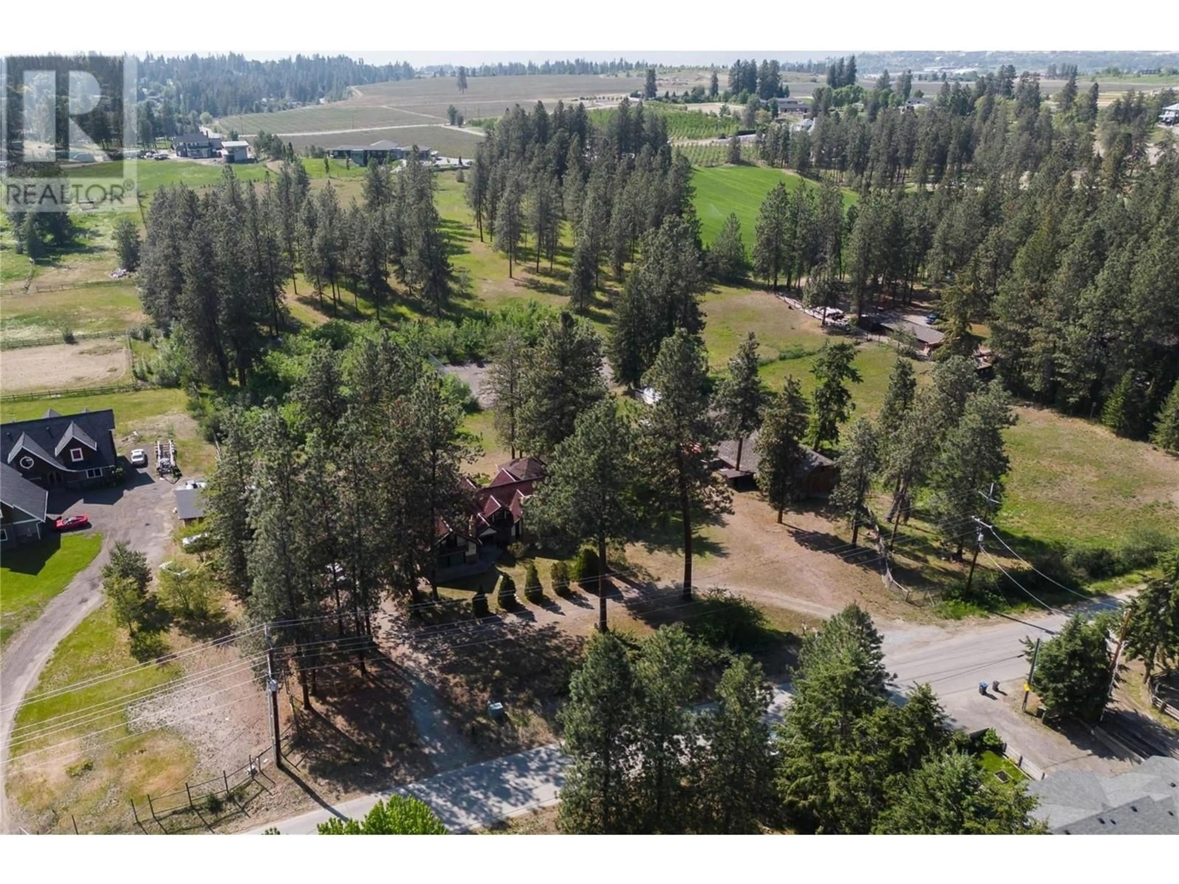A pic from outside/outdoor area/front of a property/back of a property/a pic from drone, forest/trees view for 4610 STEWART ROAD EAST, Kelowna British Columbia V1W4C1