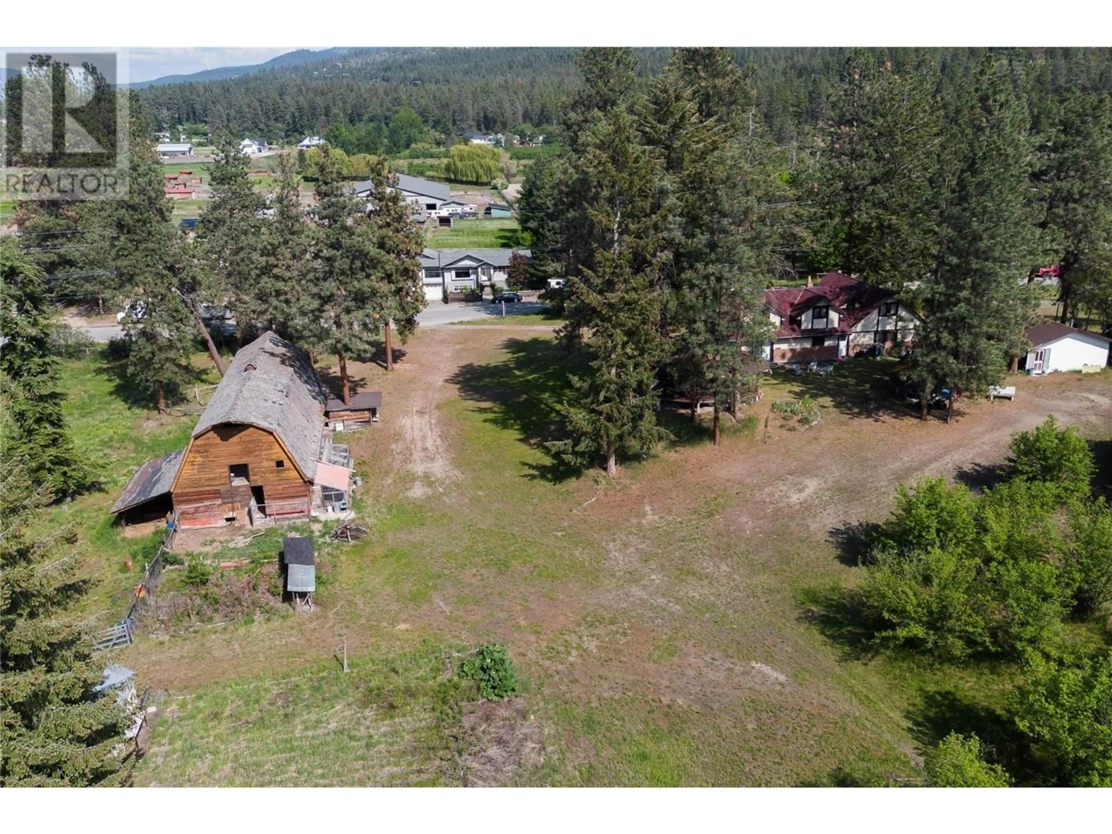 A pic from outside/outdoor area/front of a property/back of a property/a pic from drone, mountain view for 4610 STEWART ROAD EAST, Kelowna British Columbia V1W4C1