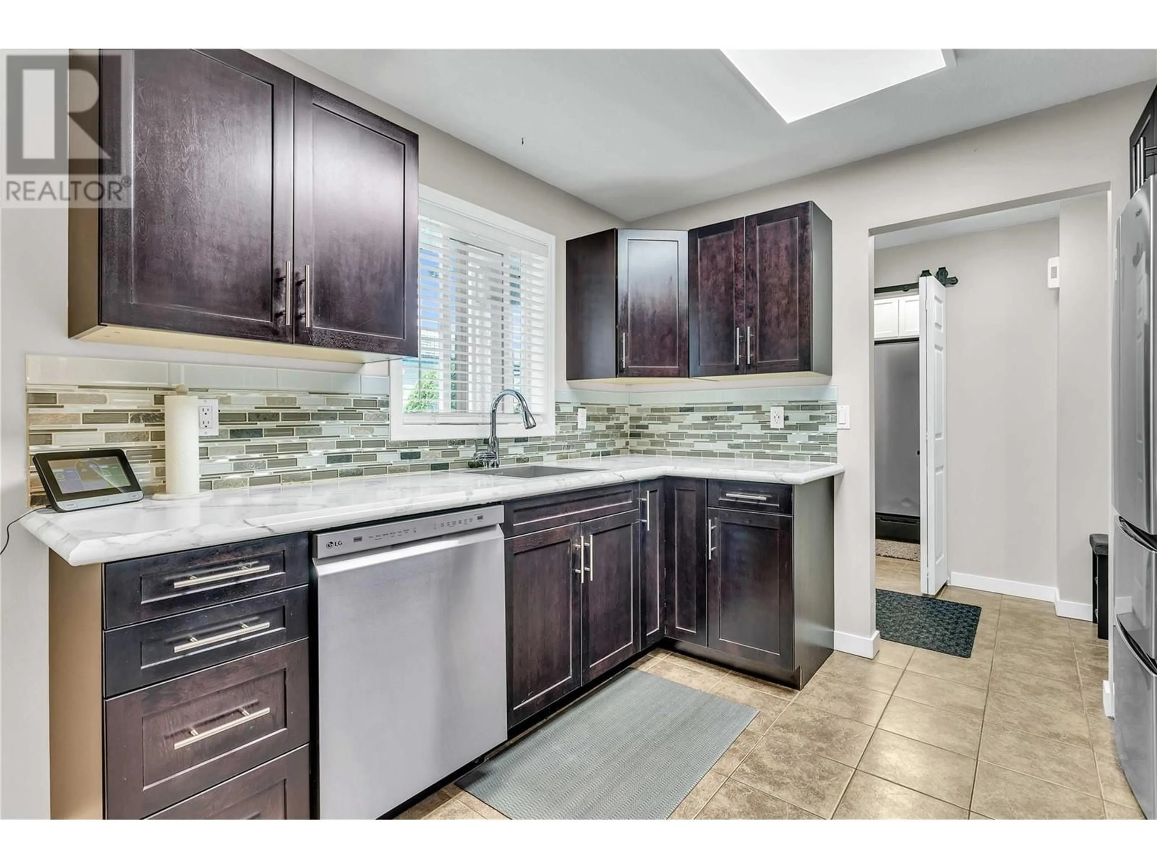 Standard kitchen, ceramic/tile floor for 104 - 1480 TERAI ROAD, Kelowna British Columbia V1X7H3