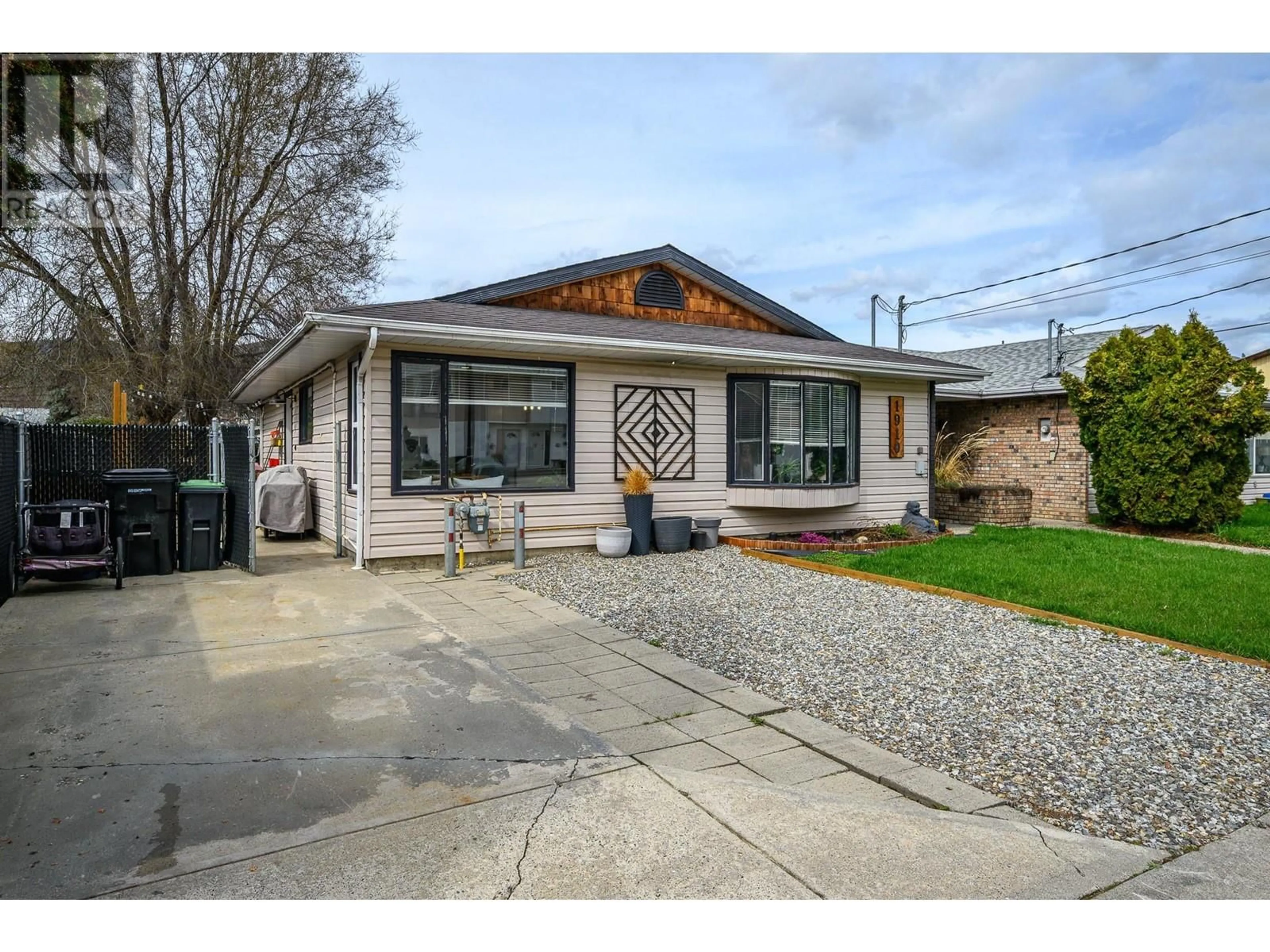 Home with vinyl exterior material, street for 1910 42A STREET, Vernon British Columbia V1T9C5