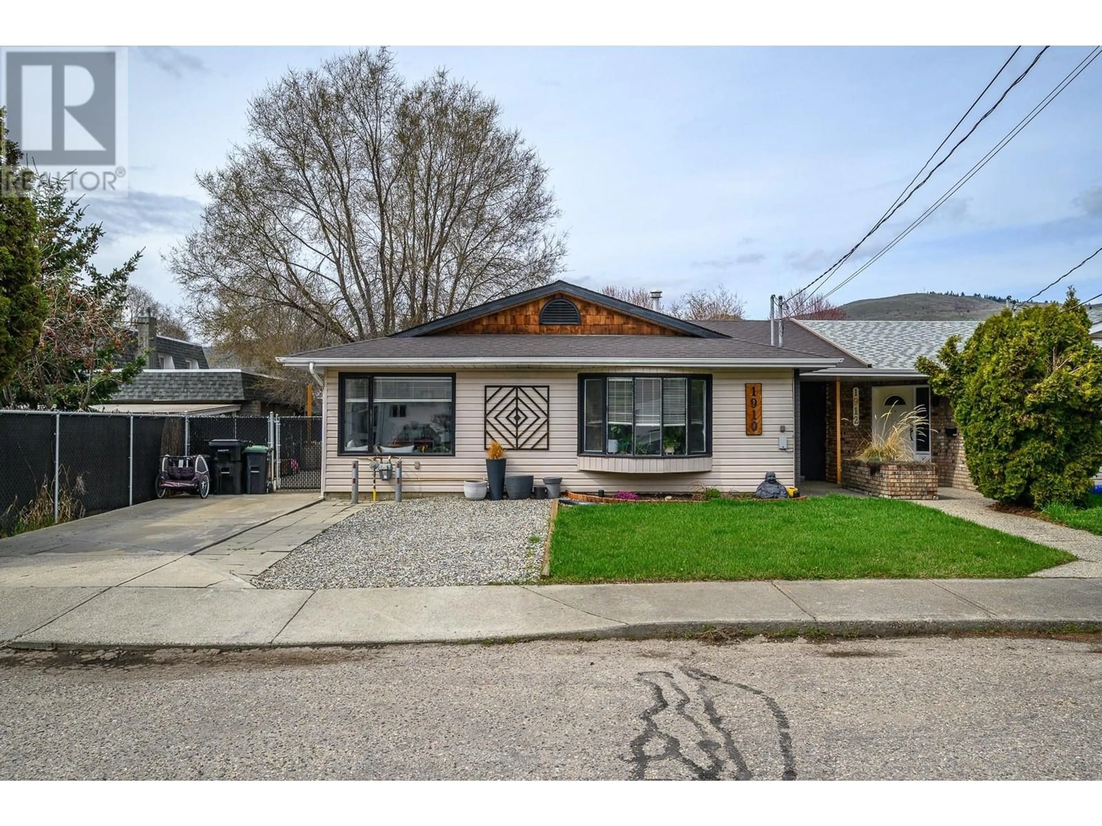 Home with brick exterior material, street for 1910 42A STREET, Vernon British Columbia V1T9C5