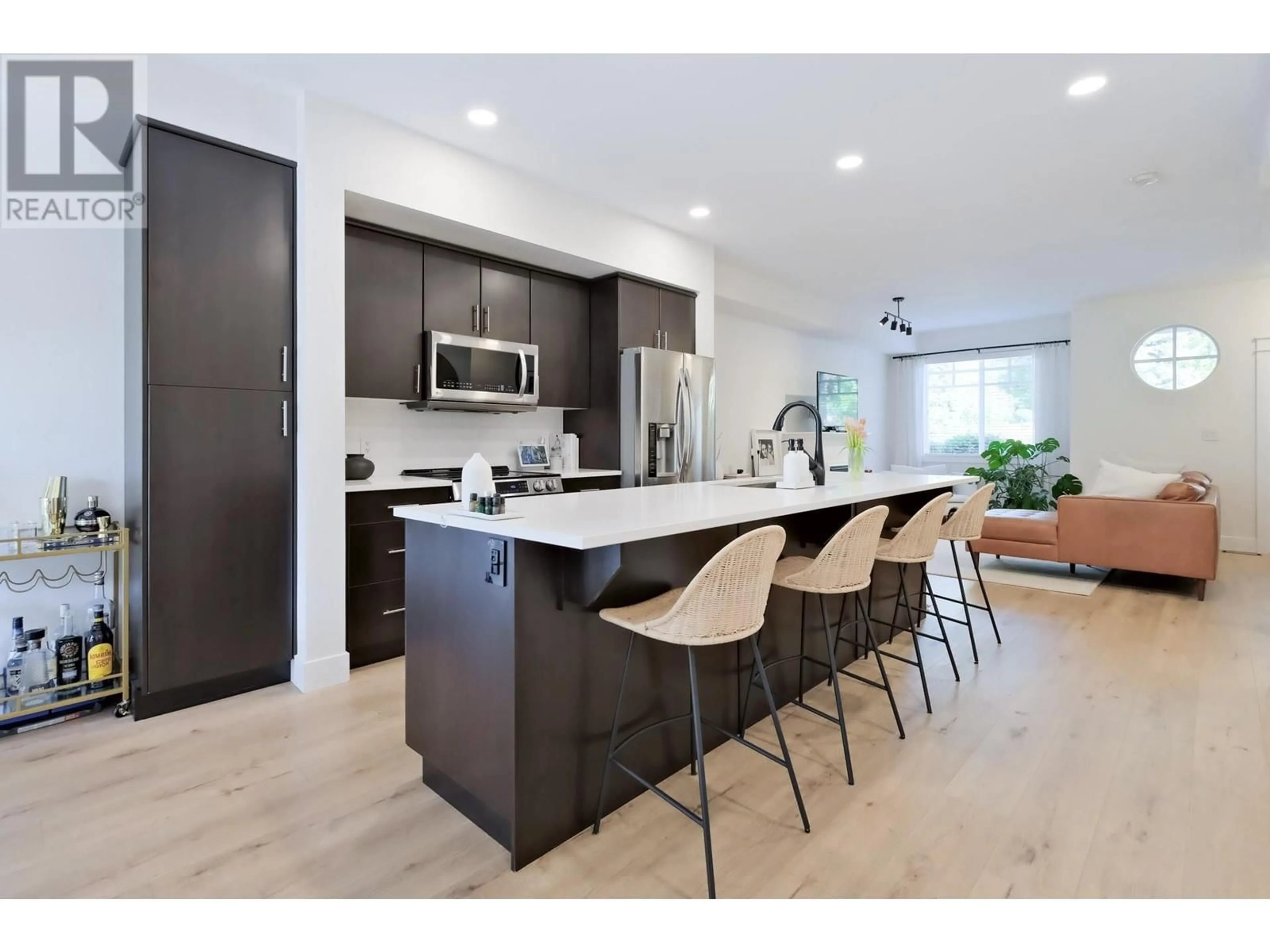 Open concept kitchen, wood/laminate floor for 20 - 433 MCCARREN AVENUE, Kelowna British Columbia V1W4T8