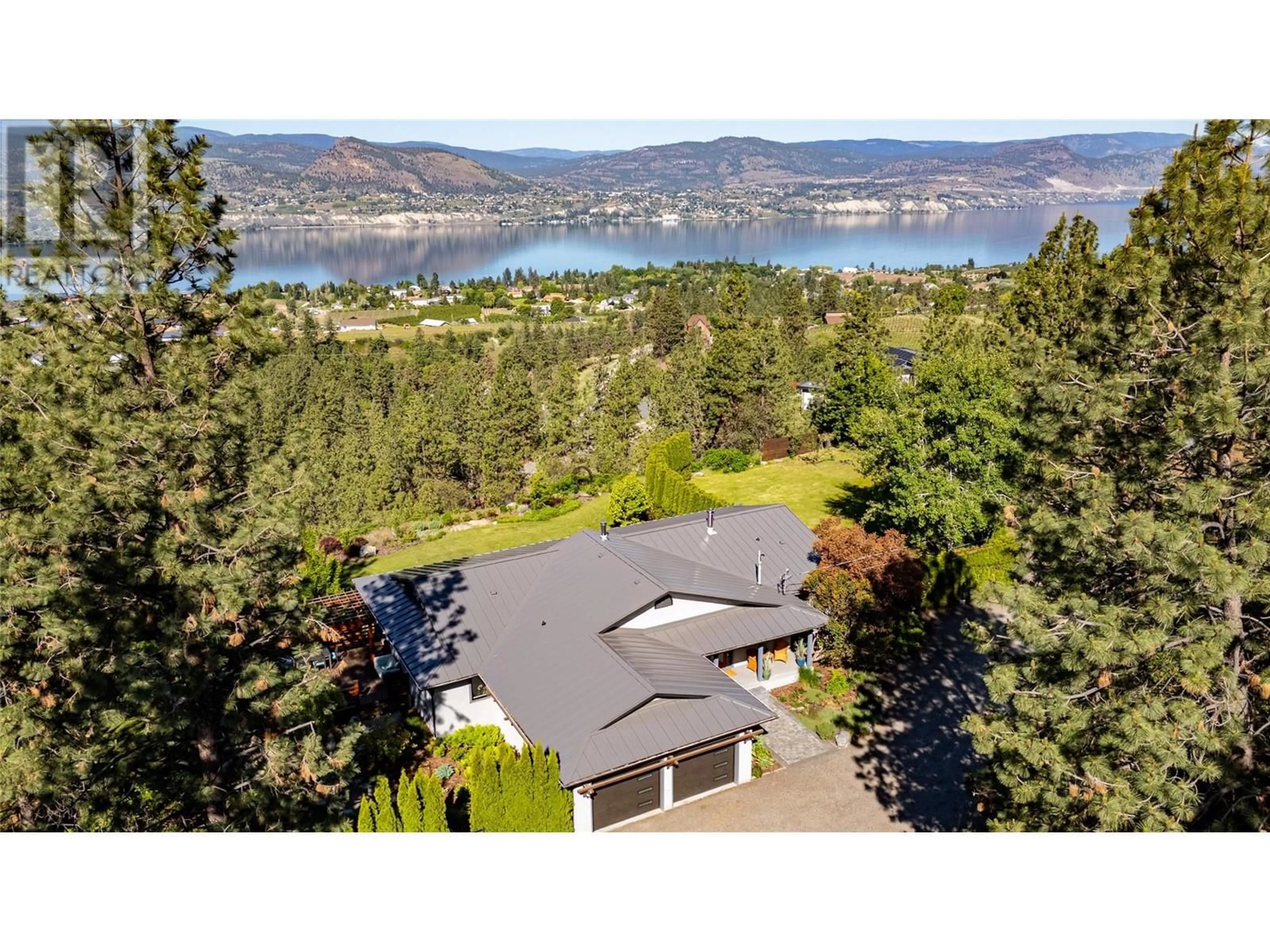 A pic from outside/outdoor area/front of a property/back of a property/a pic from drone, water/lake/river/ocean view for 1306 SMETHURST ROAD, Naramata British Columbia V0H1N0