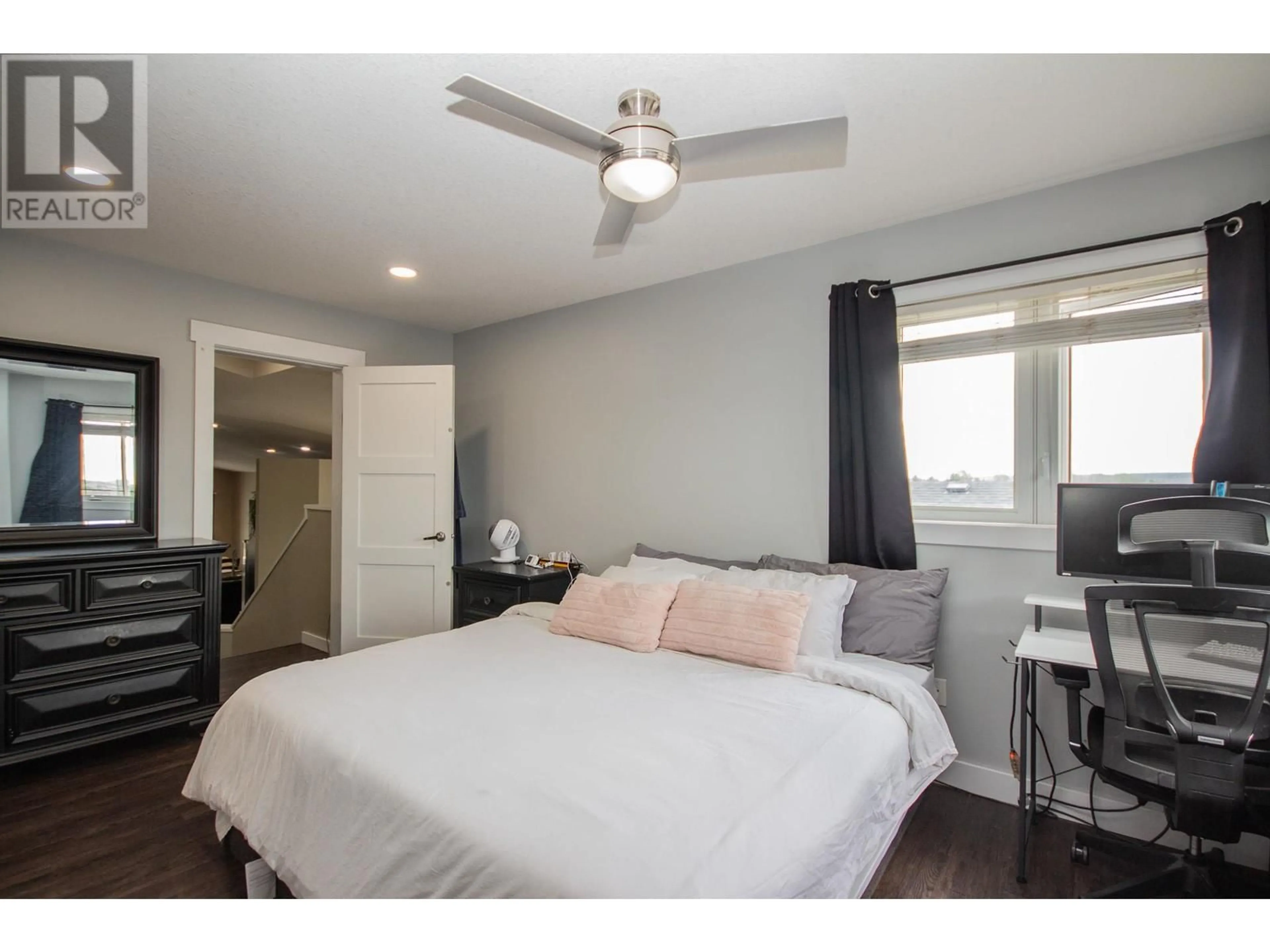 Bedroom with bed, wood/laminate floor for 8412 18A STREET, Dawson Creek British Columbia V1G0E2