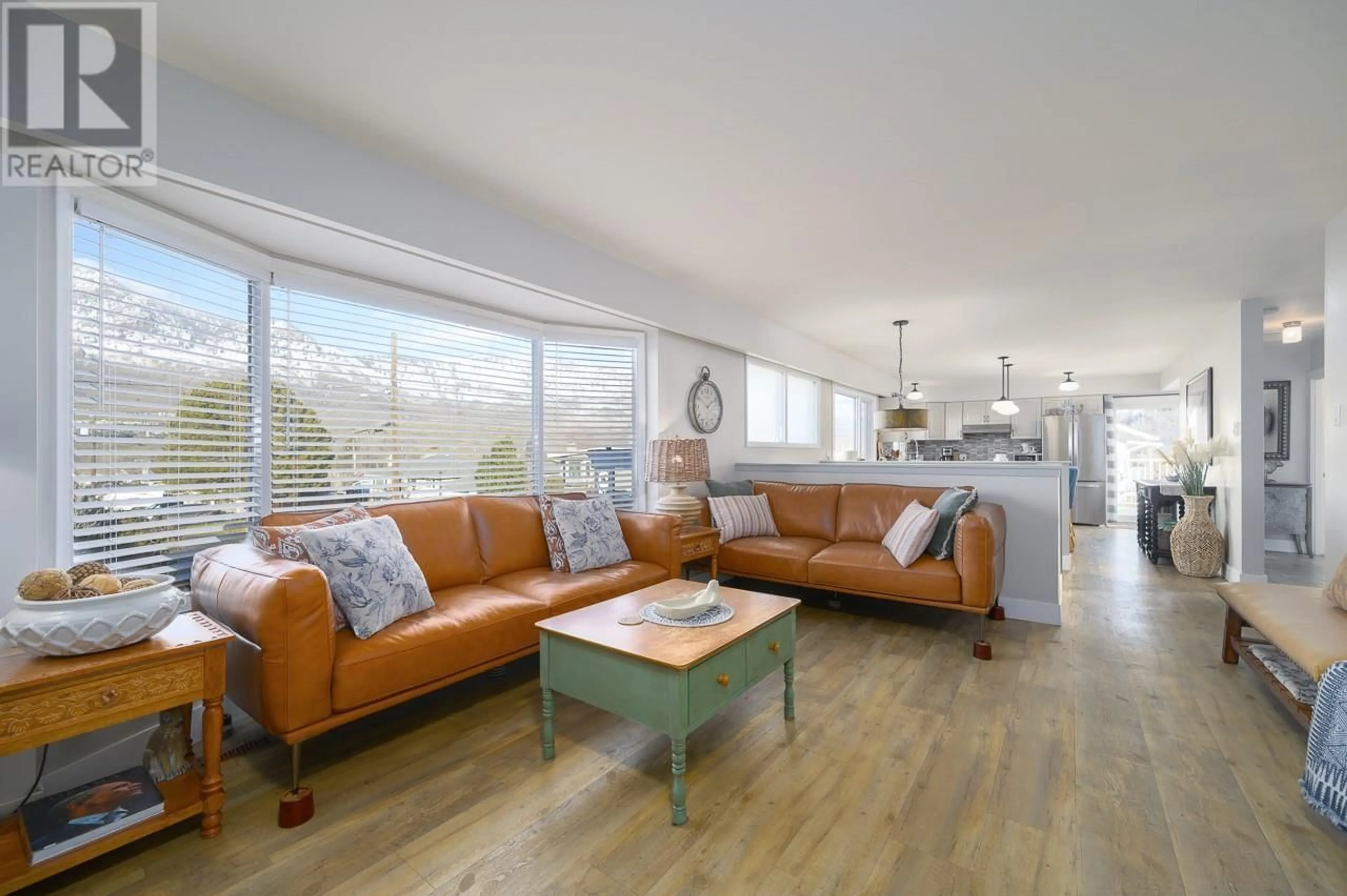 Living room with furniture, wood/laminate floor for 1742 APPLE LANE, Kamloops British Columbia V2C4M9