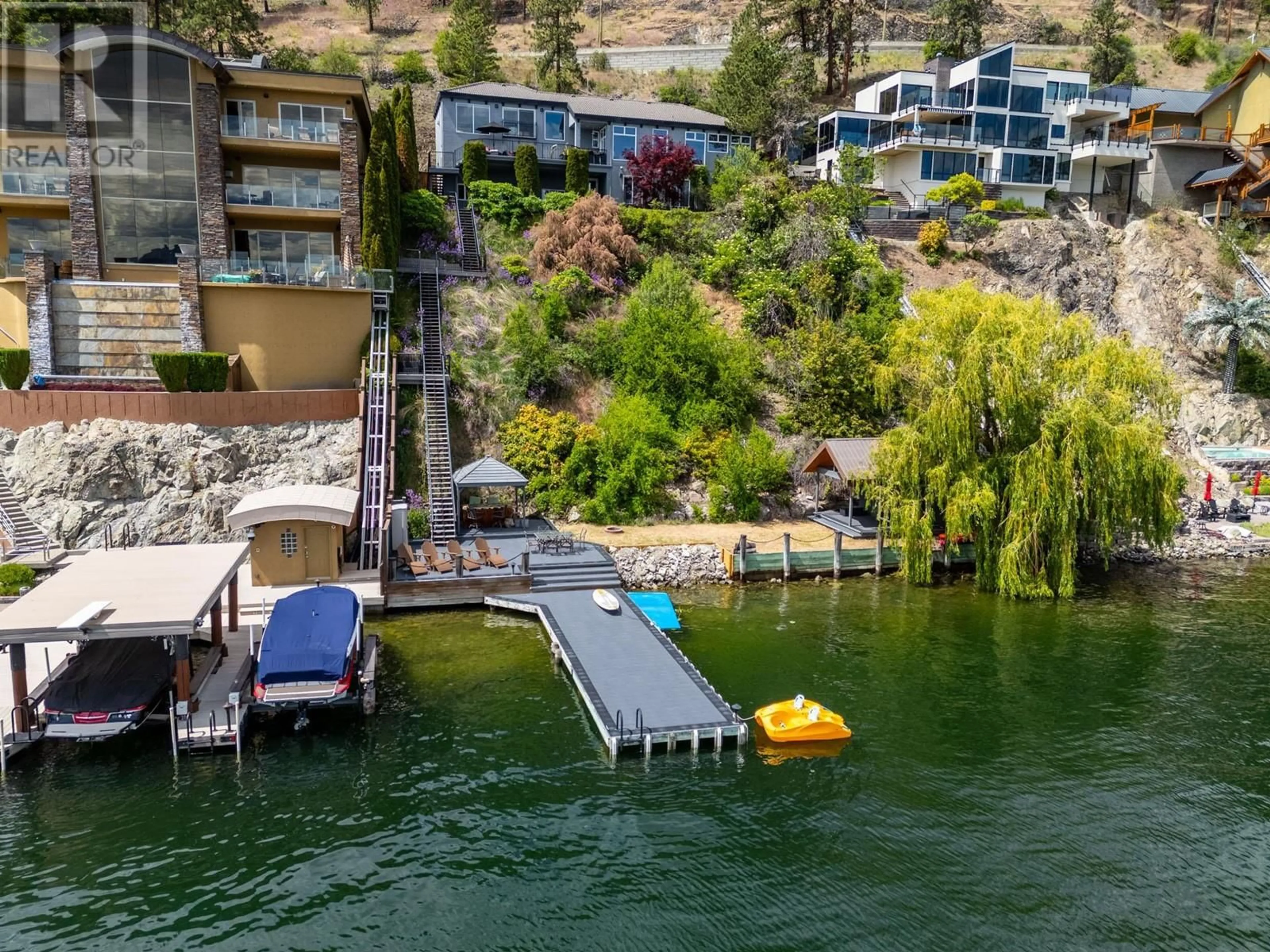 A pic from outside/outdoor area/front of a property/back of a property/a pic from drone, water/lake/river/ocean view for 7 - 901 WESTSIDE ROAD SOUTH, West Kelowna British Columbia V1Z3W9